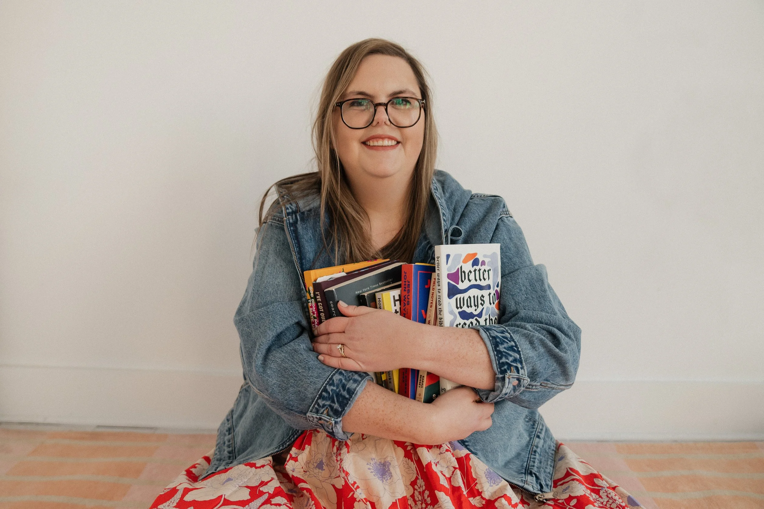 Girl with books in crossed arms