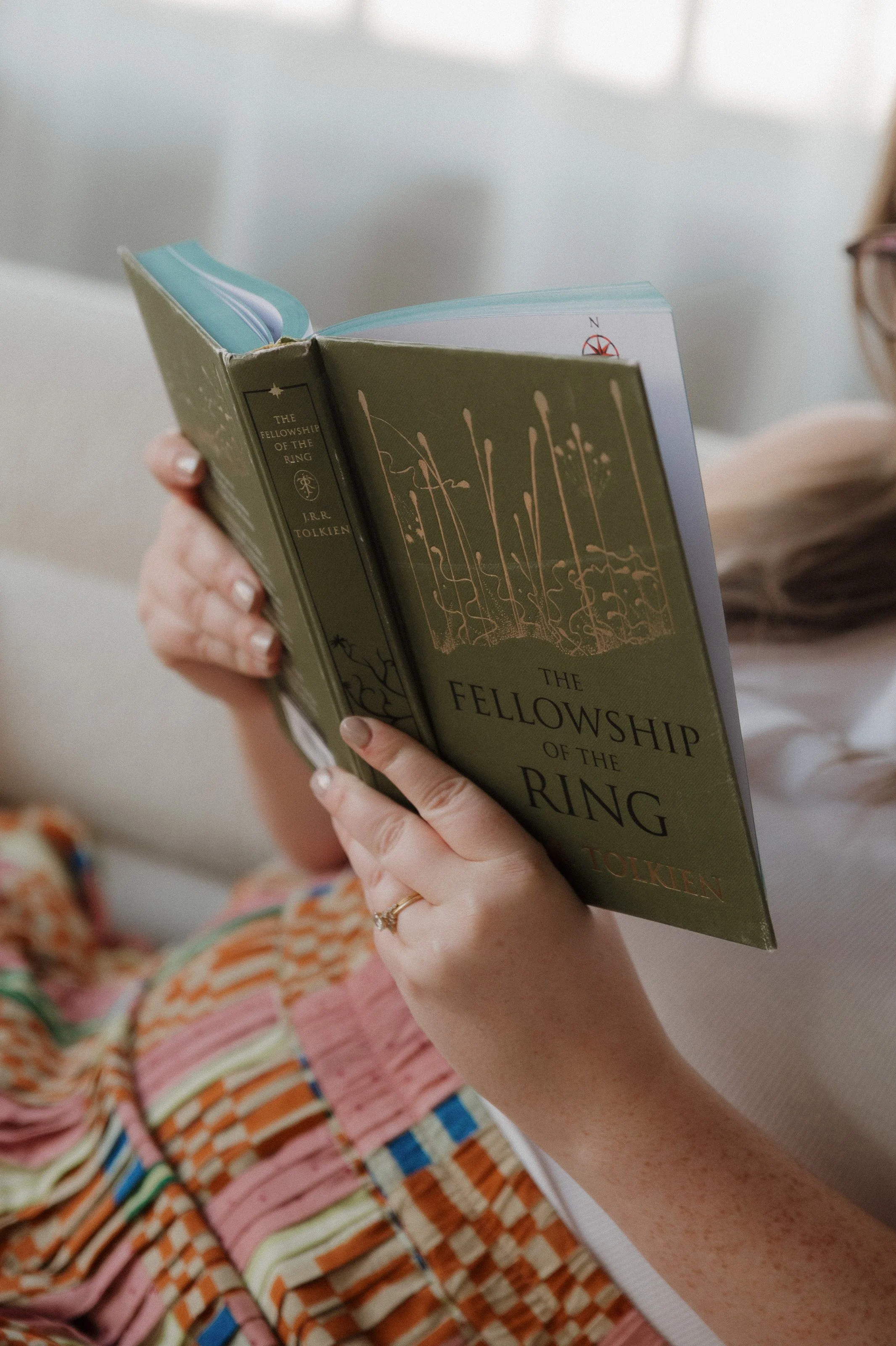 Woman reading The Fellowship of the Ring