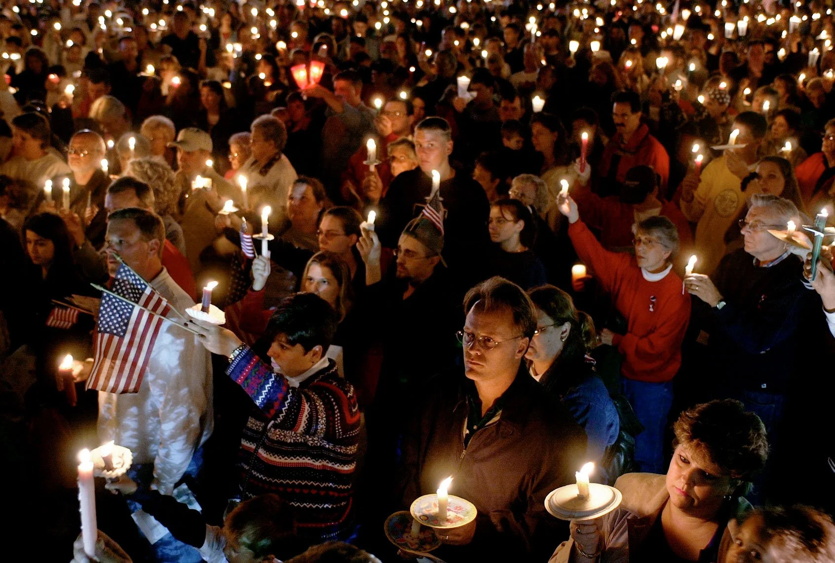 In the days that followed, Americans gathered in communities across the country to mourn, support one another, and honor those who had been lost.
