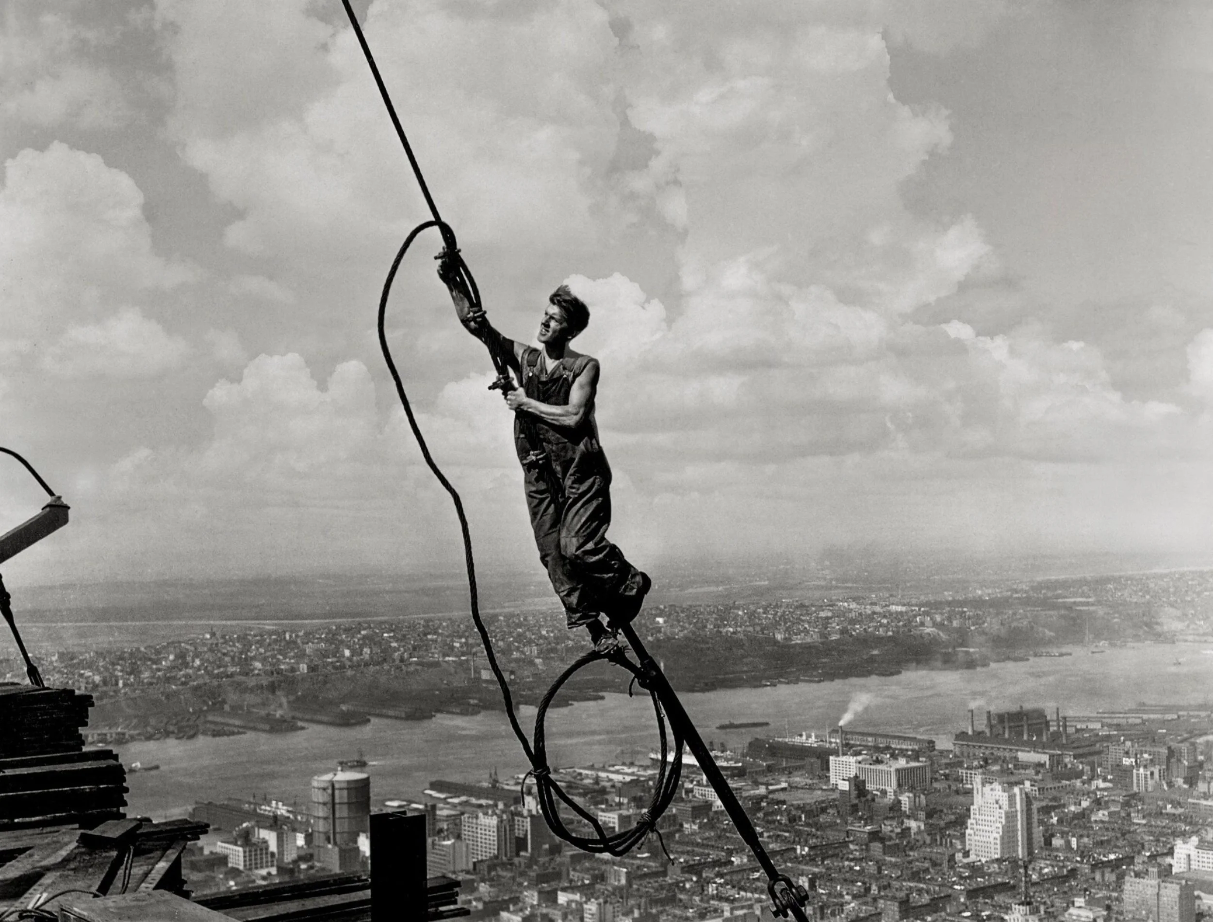 Lewis Hine. Steelworker balancing high above New York City during construction of the Empire State Building.