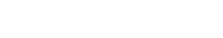 Close-up of a sign displaying the words 'DISTRICT CANDLE LAB' in white text on a black background.