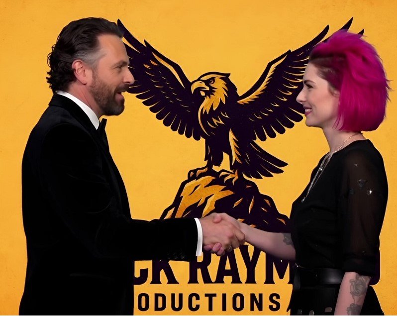 Rock Raymond Productions CEO Ray Shasho shakes hands with Kylie Willow