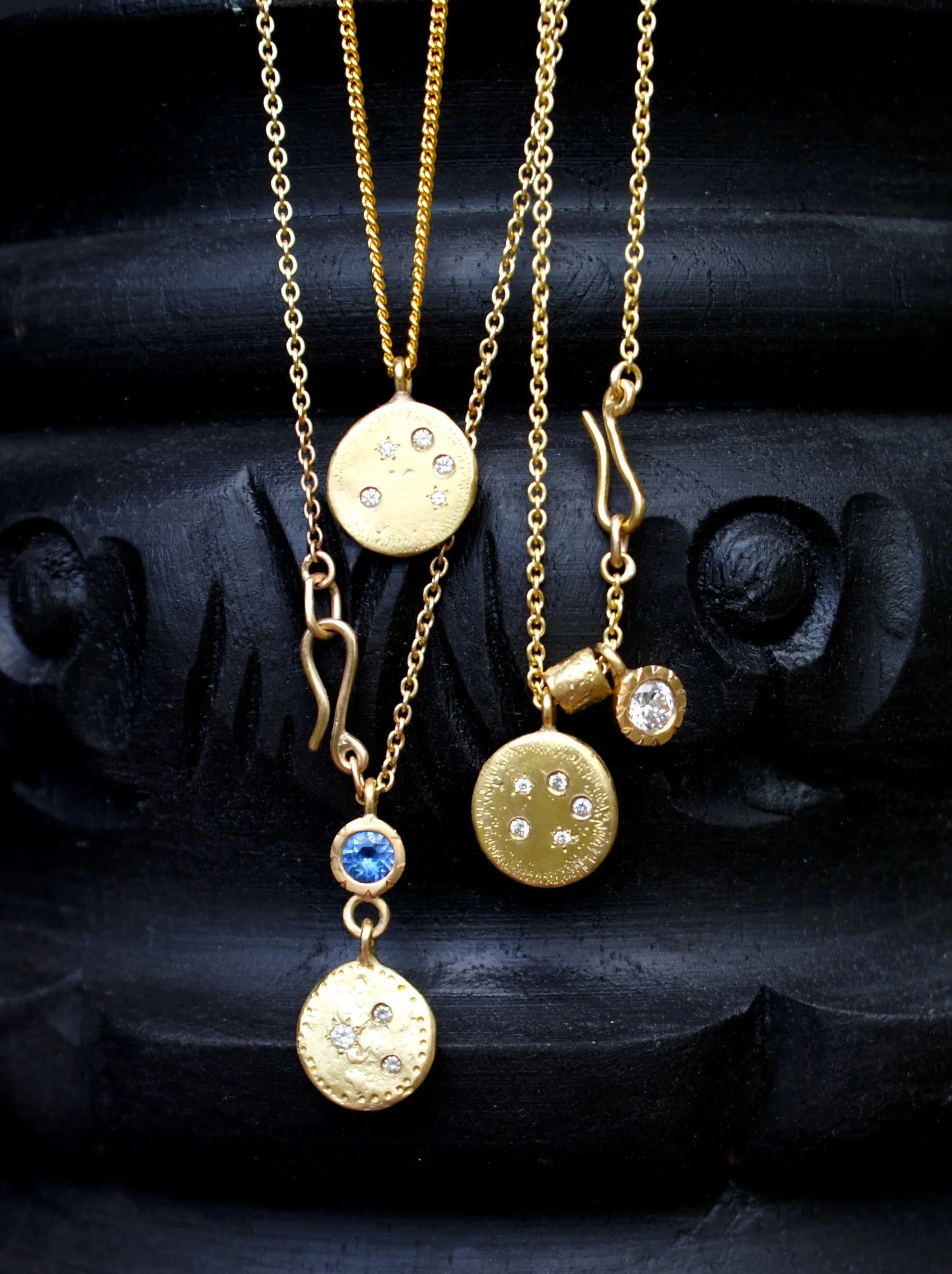 Repurposed gold pendants from clients gold and diamonds. 