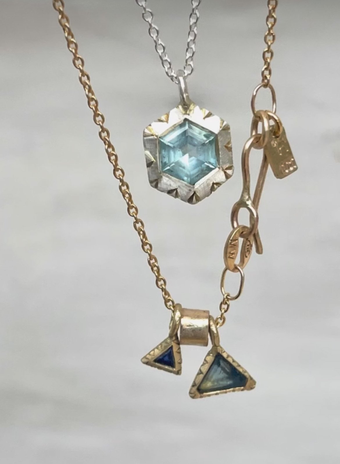 Hand made gold Pendants with Sapphires and Aquamarine.