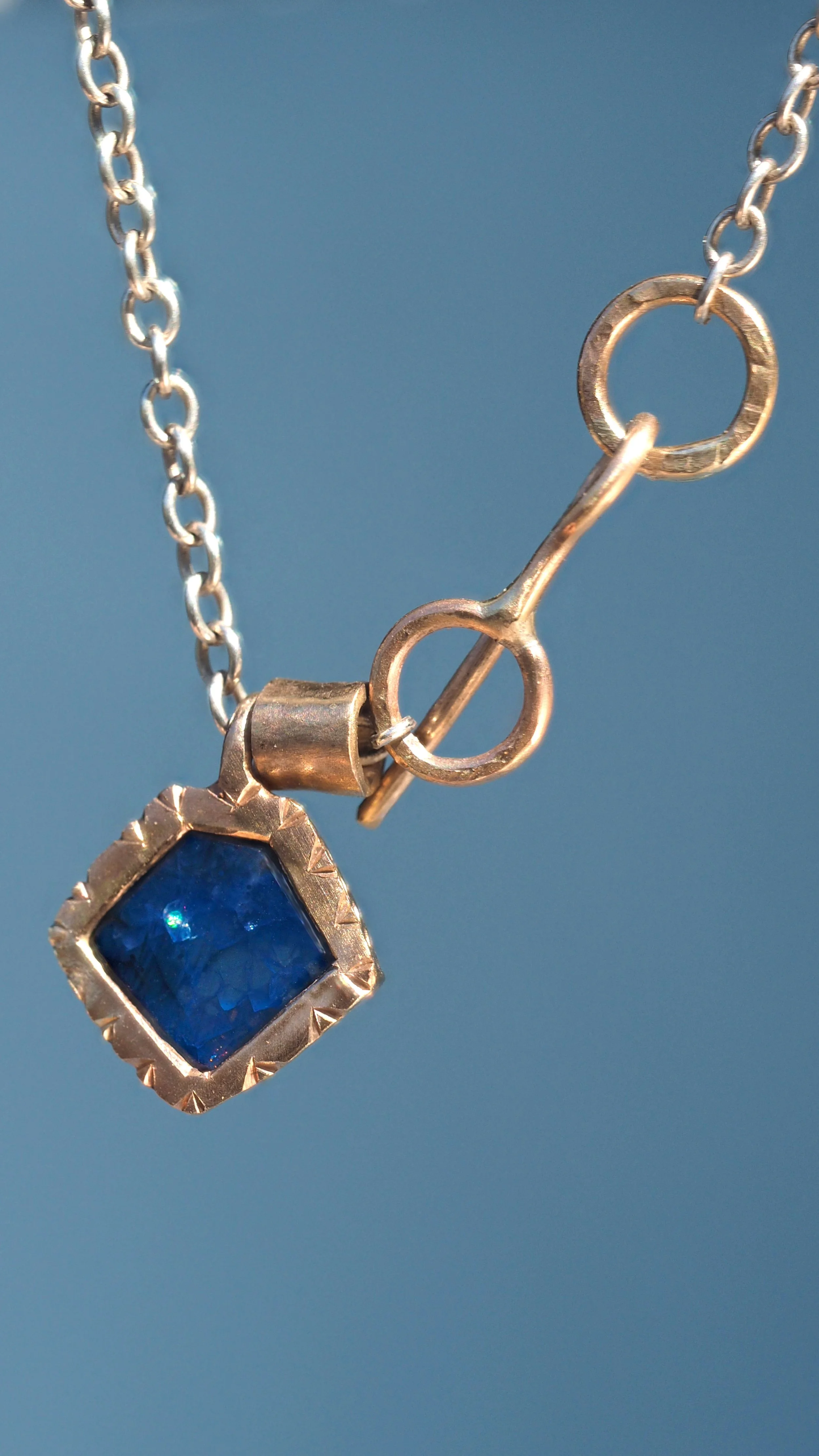 Sapphire and gold pendant hand made by Georgie Brooks