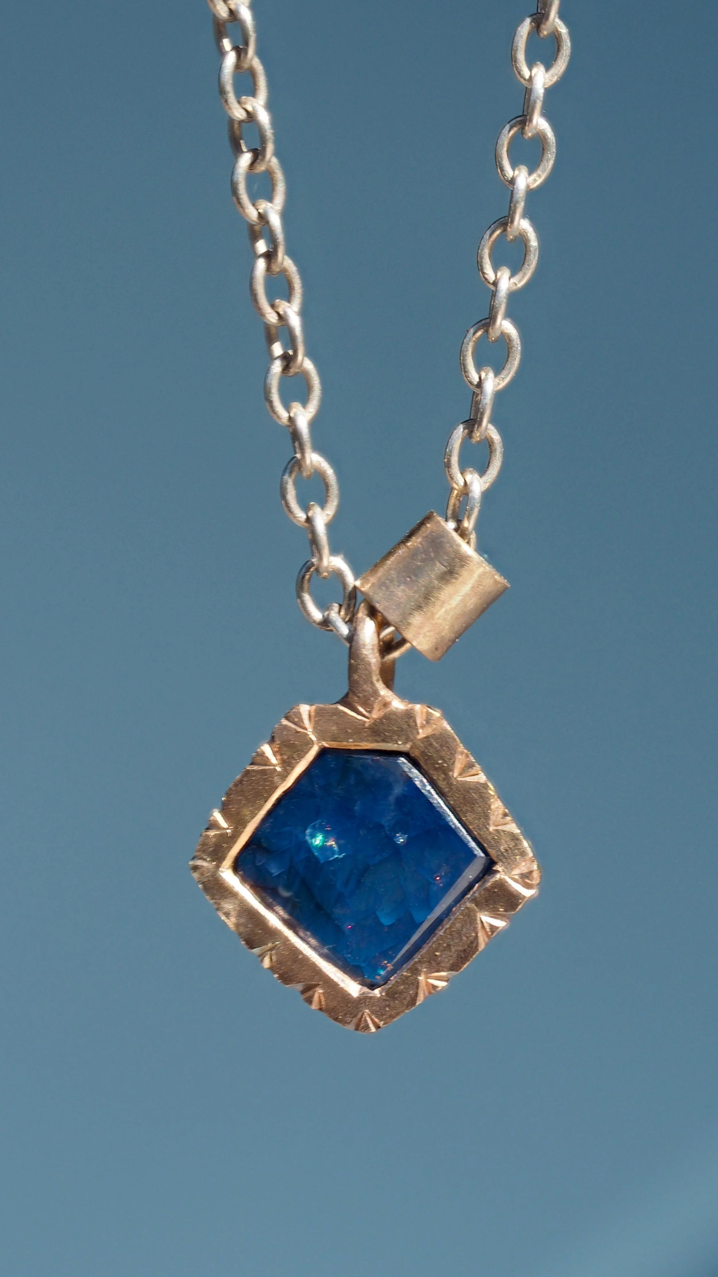 gold and sapphire pendant hand made by Georgie Brooks