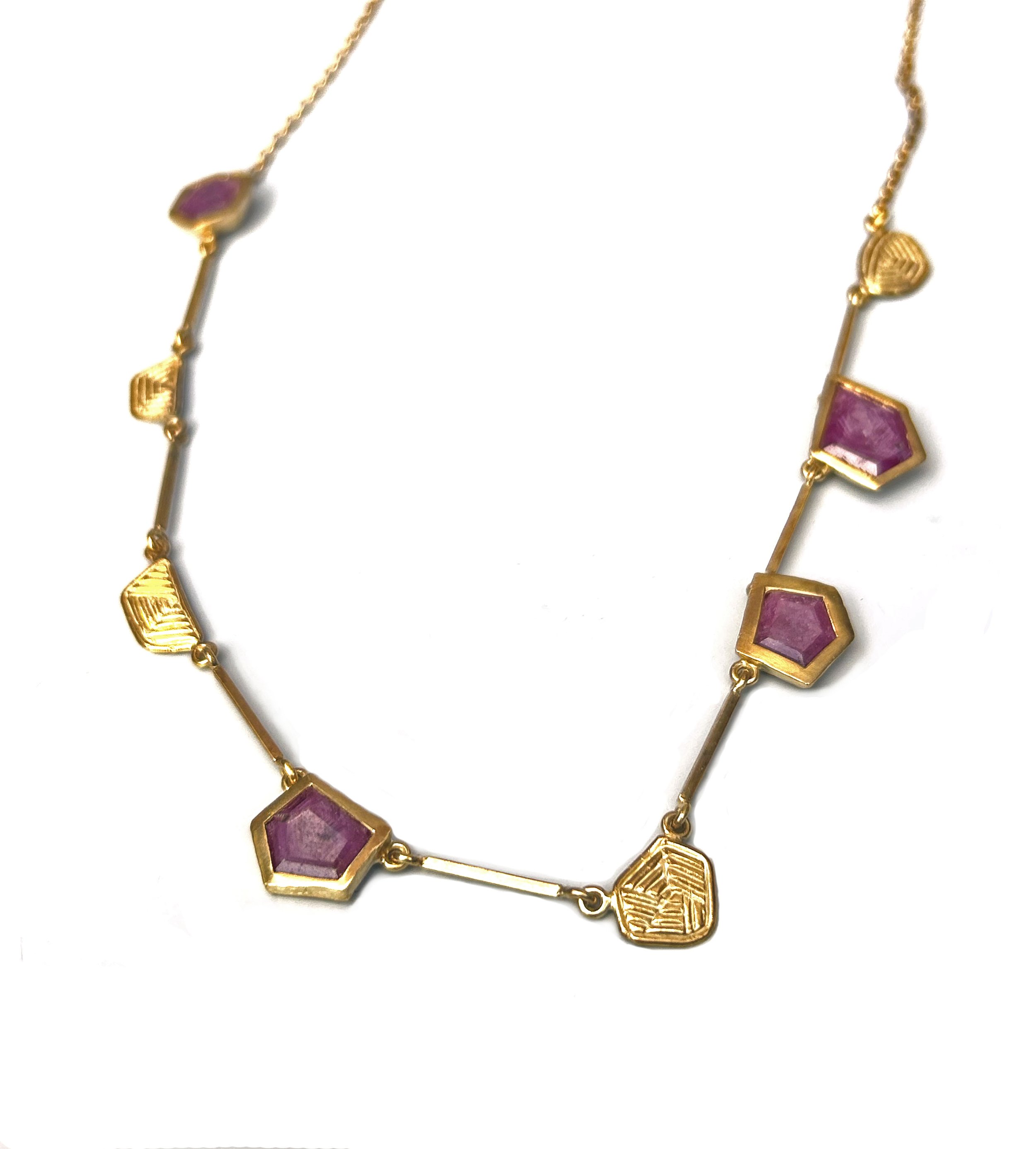 Triapche Ruby Slice neck piece in yellow gold.