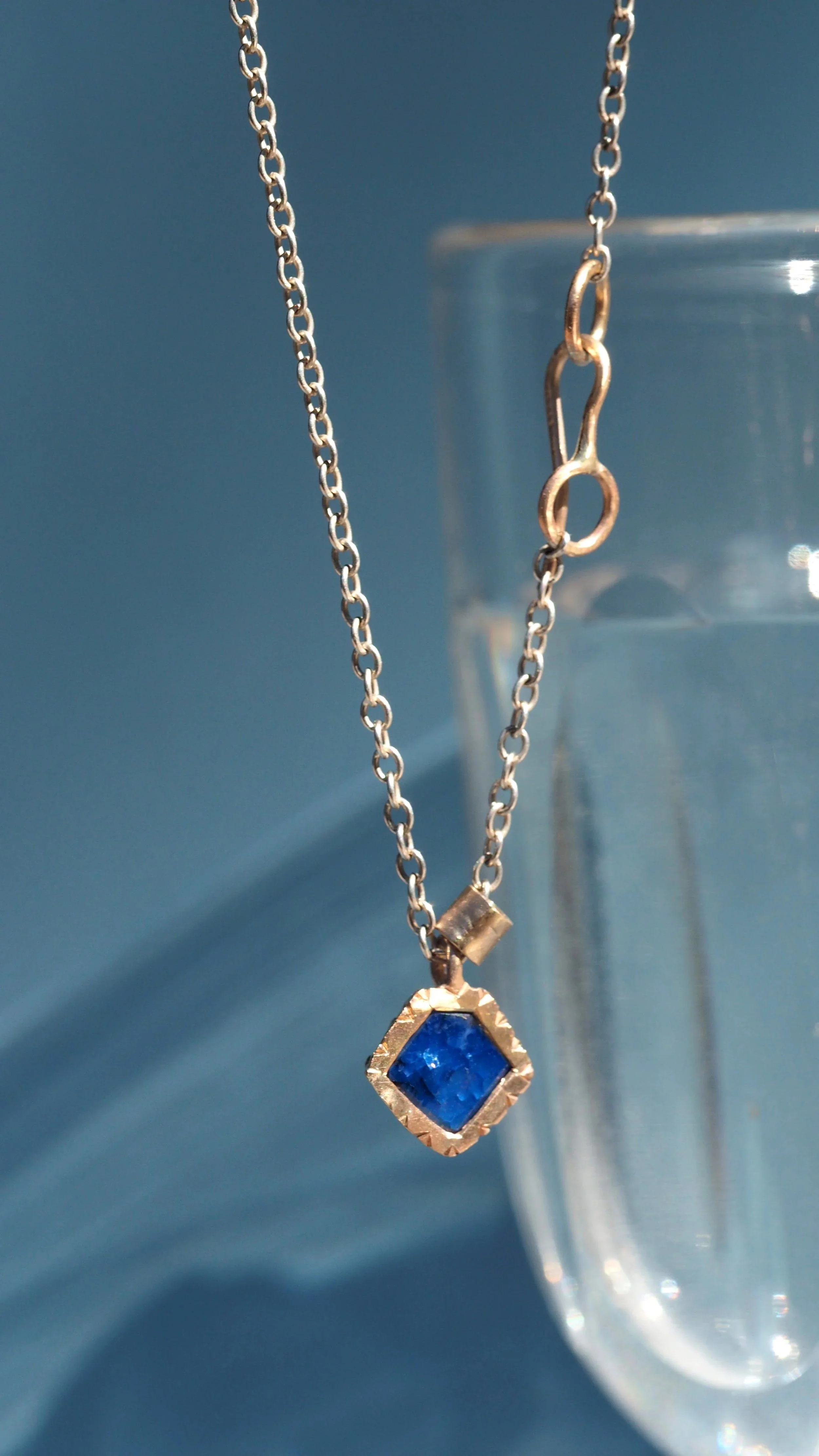 gold and sapphire pendant by Georgie Brooks