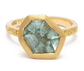 A hand made gold ring by Georgie Brooks featuring a hand cut Australian Aquamarine