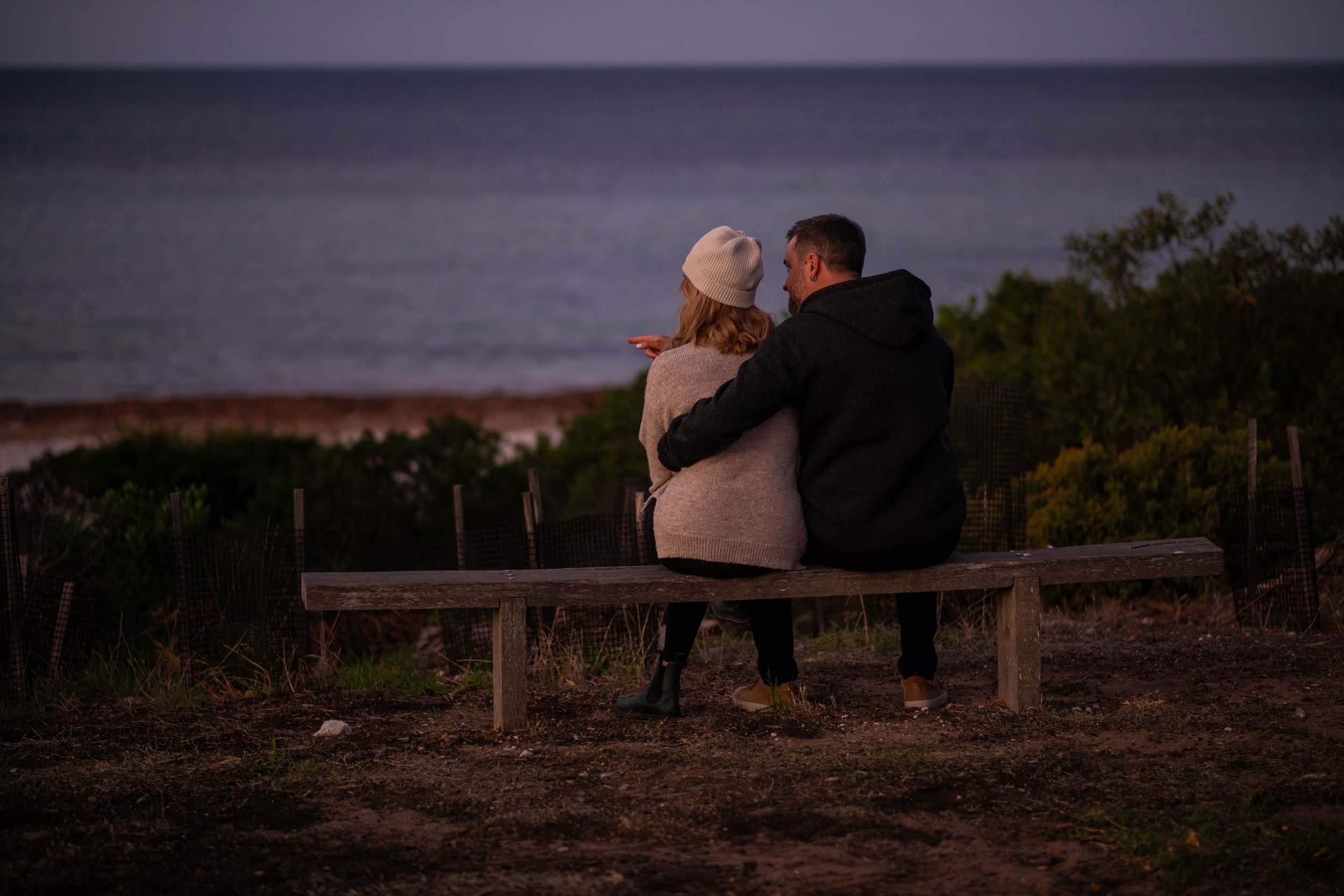 A couple watching the sunset at Emu Bay on their Kangaroo Island tour