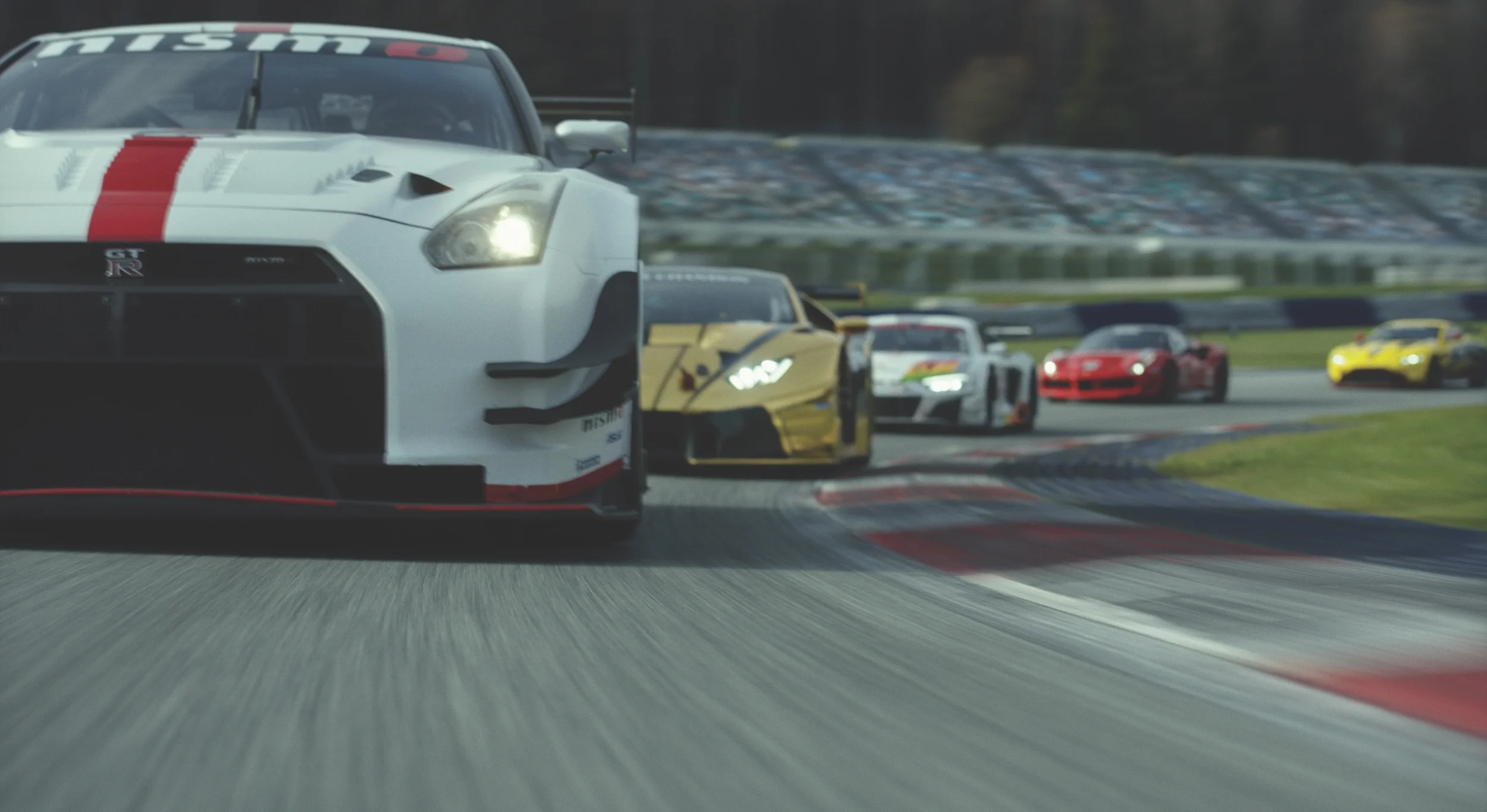 A group of race cars on a track, led by a white Nissan GT-R, followed by a black and gold car, with additional white, red, and yellow cars in the background.