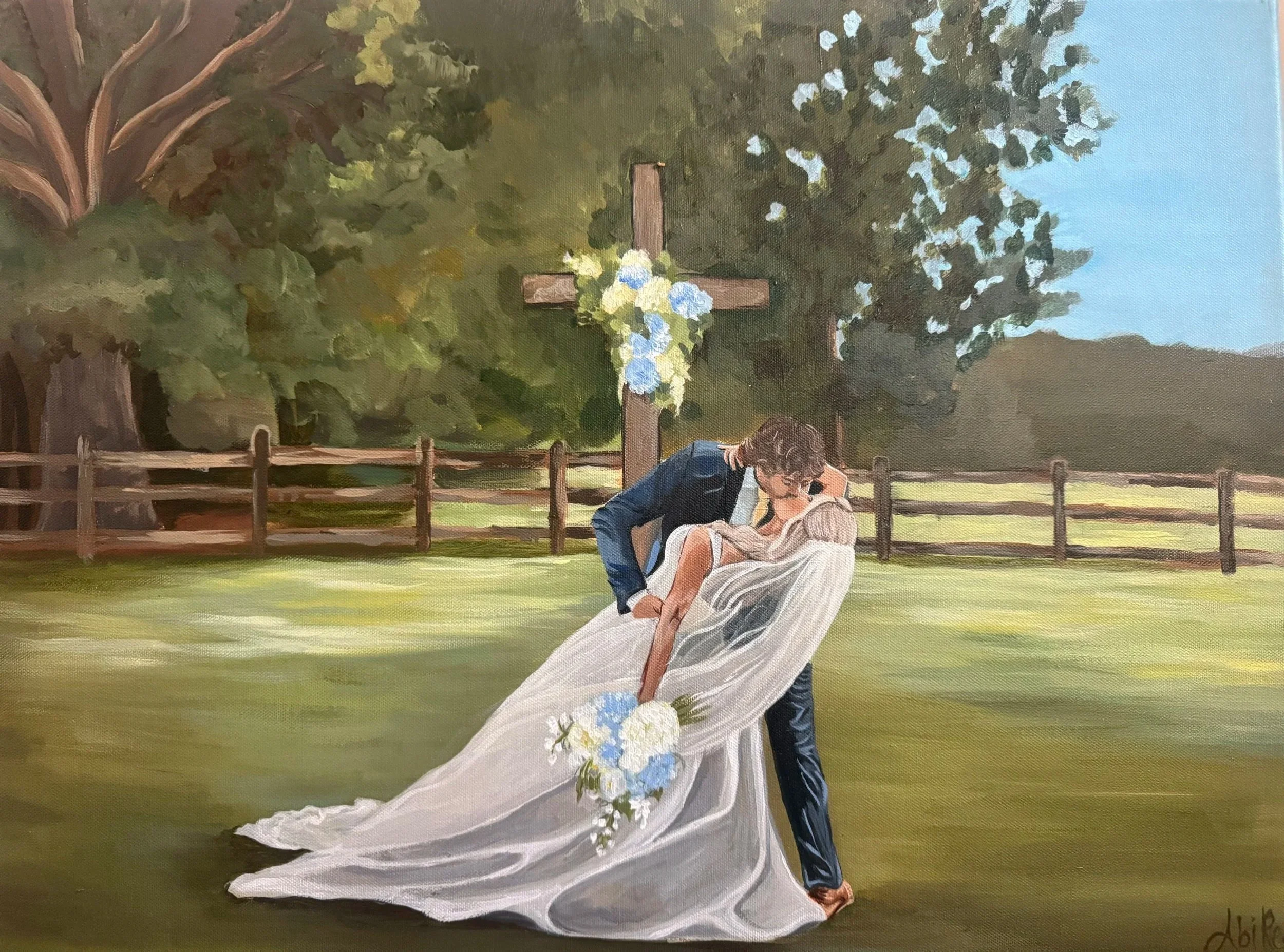A painting of a bride and groom kissing outdoors in front of a wooden cross decorated with flowers, with a green lawn, trees, and a blue sky in the background.
