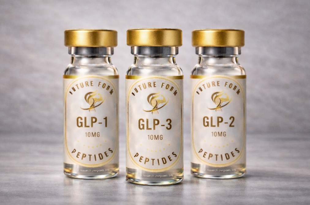 Three small glass vials labeled 'Future Form GLP-1 Peptides,' each containing 10mg, with gold caps, on a gray surface.
