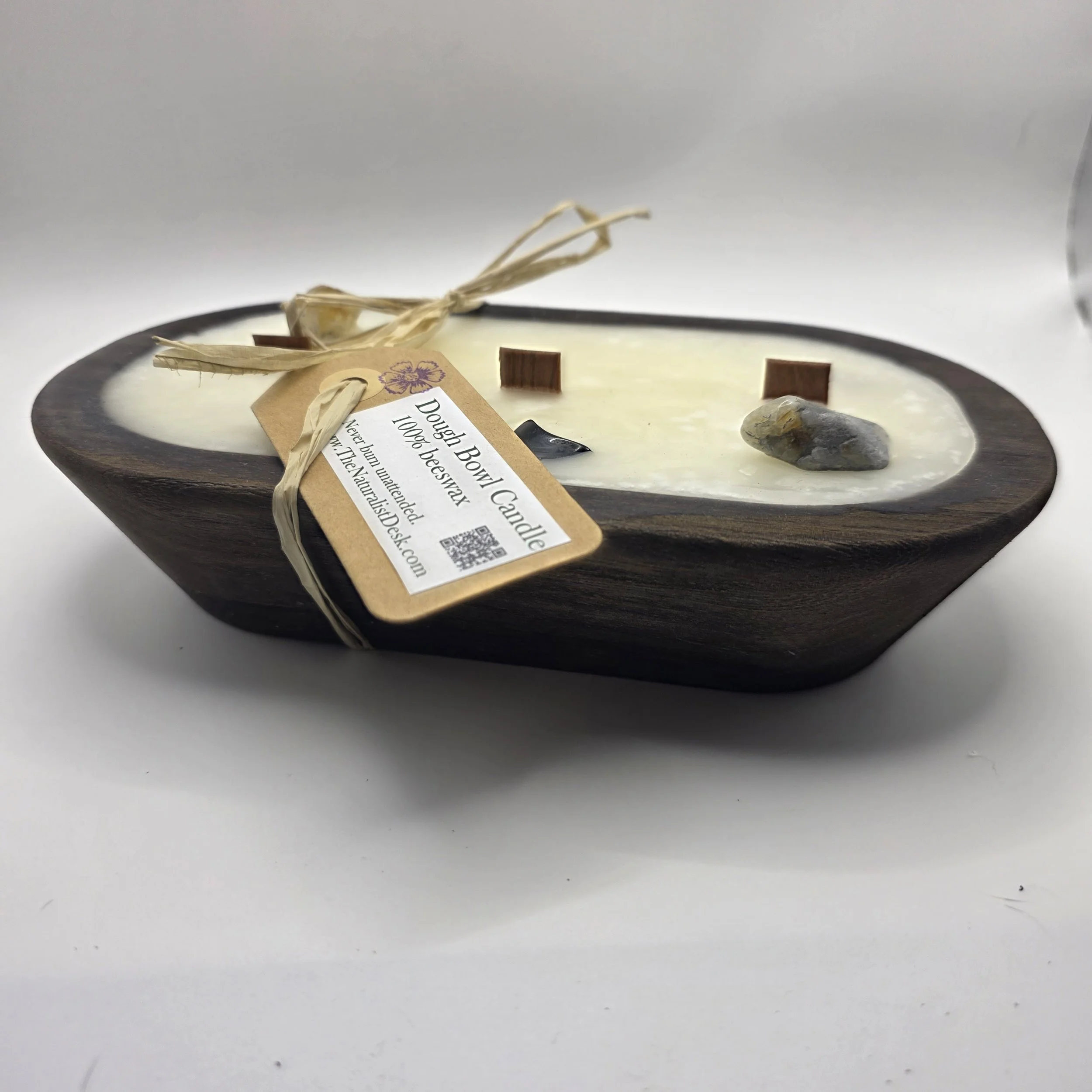 wood dough bowl candle with gemstones and product tag