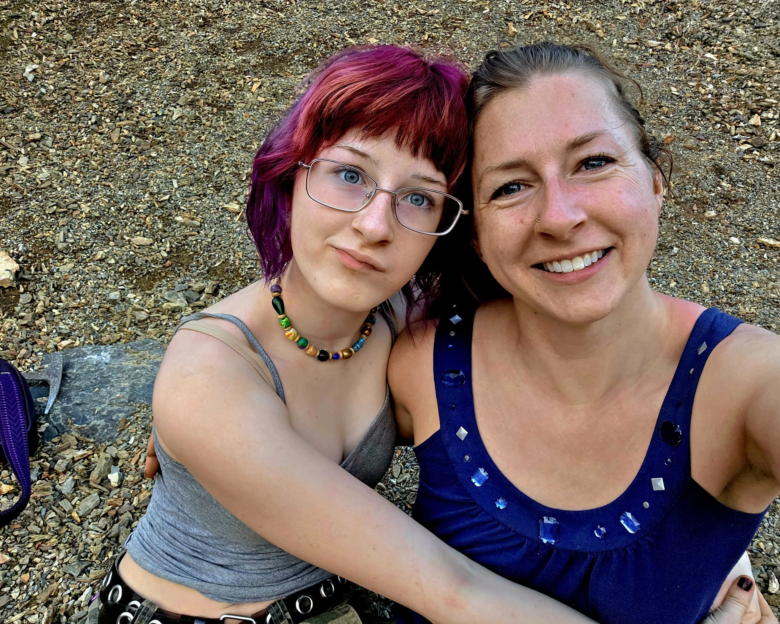 Two girls sitting at fossil pit at Swatara State Park