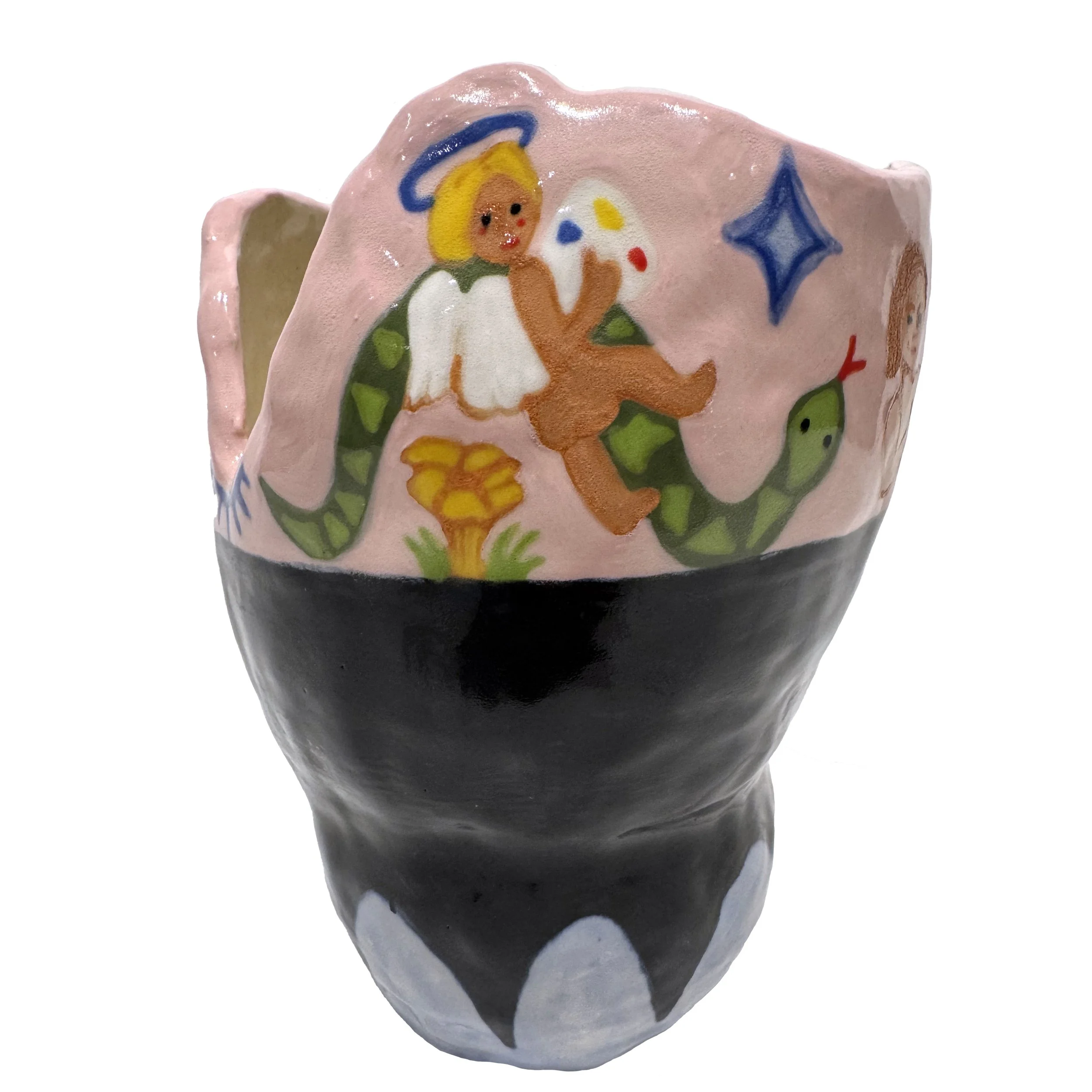 Hand-painted ceramic sculpture of an angel with a halo, holding a palette, surrounded by a snake, a mushroom, and stars on a pink background.
