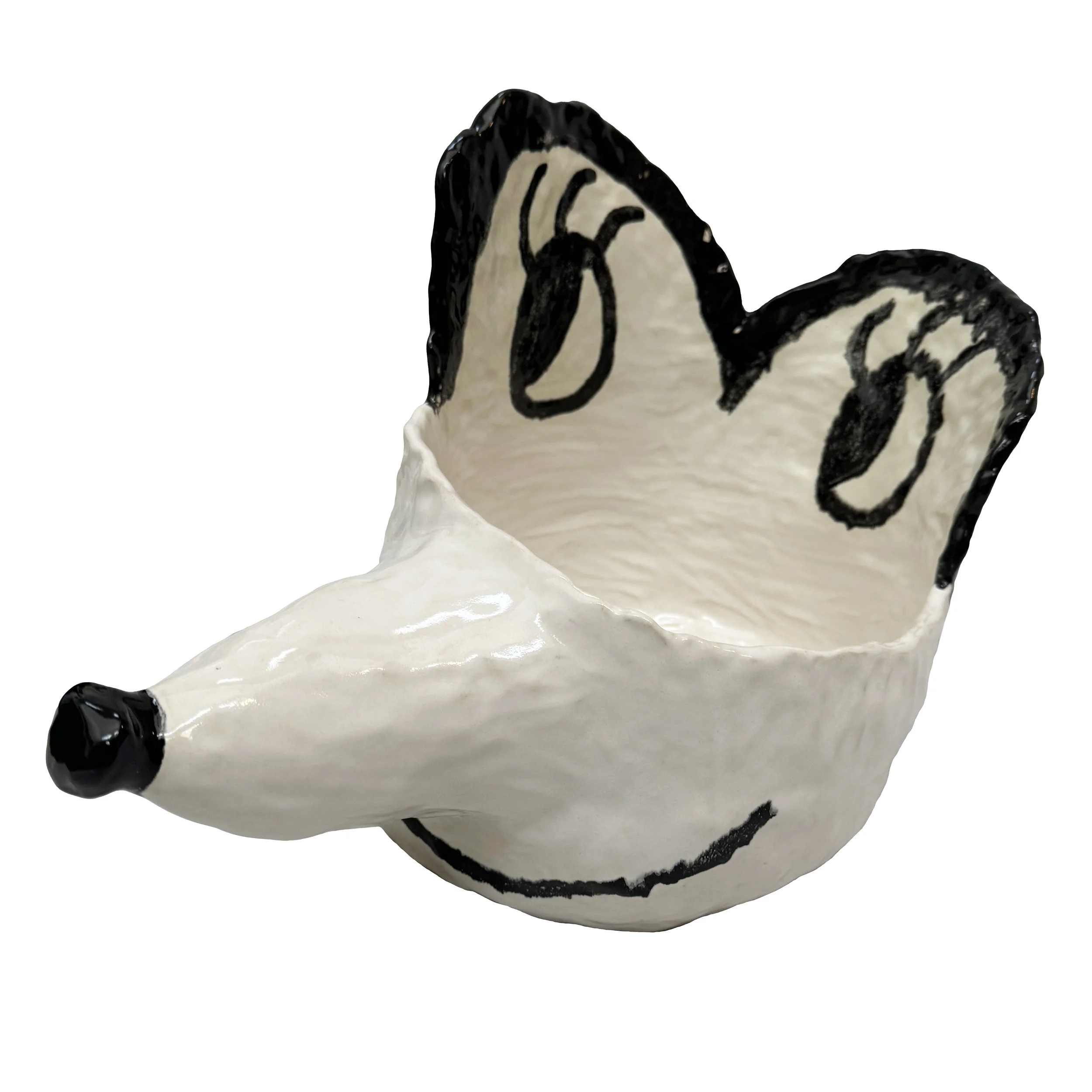 Decorative ceramic planter painted to resemble an animal's face with black eyes, nose, and ears, and a smiling mouth.