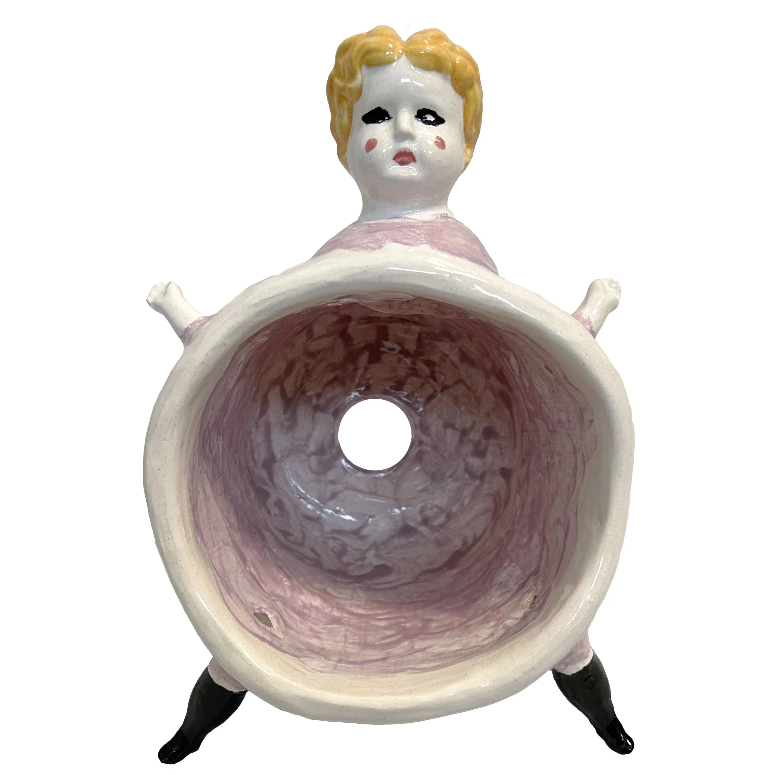 Light purple ceramic planter with a humanlike face and blonde hair, tiny arms and legs, viewed from the side showing painted internal cavity.