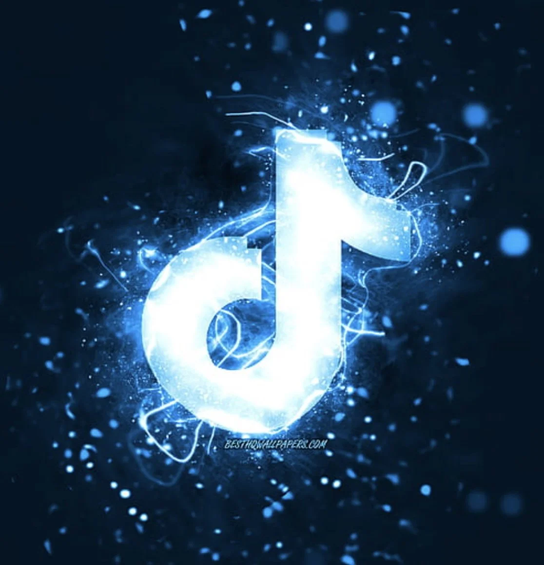 Digital art of a glowing musical note in bright blue with light particles and sparks surrounding it.