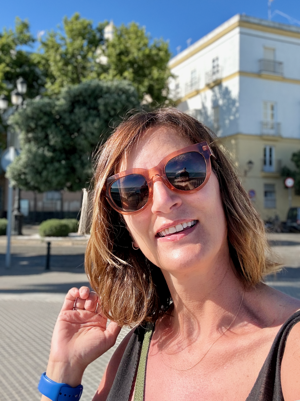 Interior and graphic designer Carla Benedetti photographed outdoors wearing sunglasses