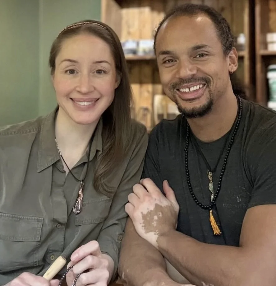 Helena and David, founders of Copperfield Jewellery, wearing pendants they made by hand