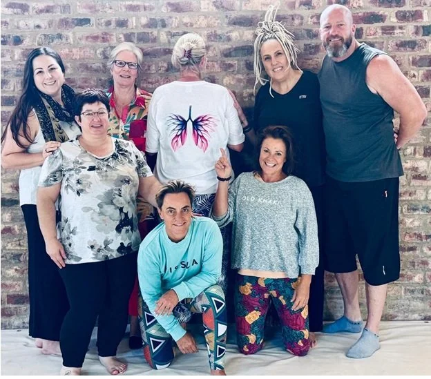 A breathwork group at a 7 Wave System workshop
