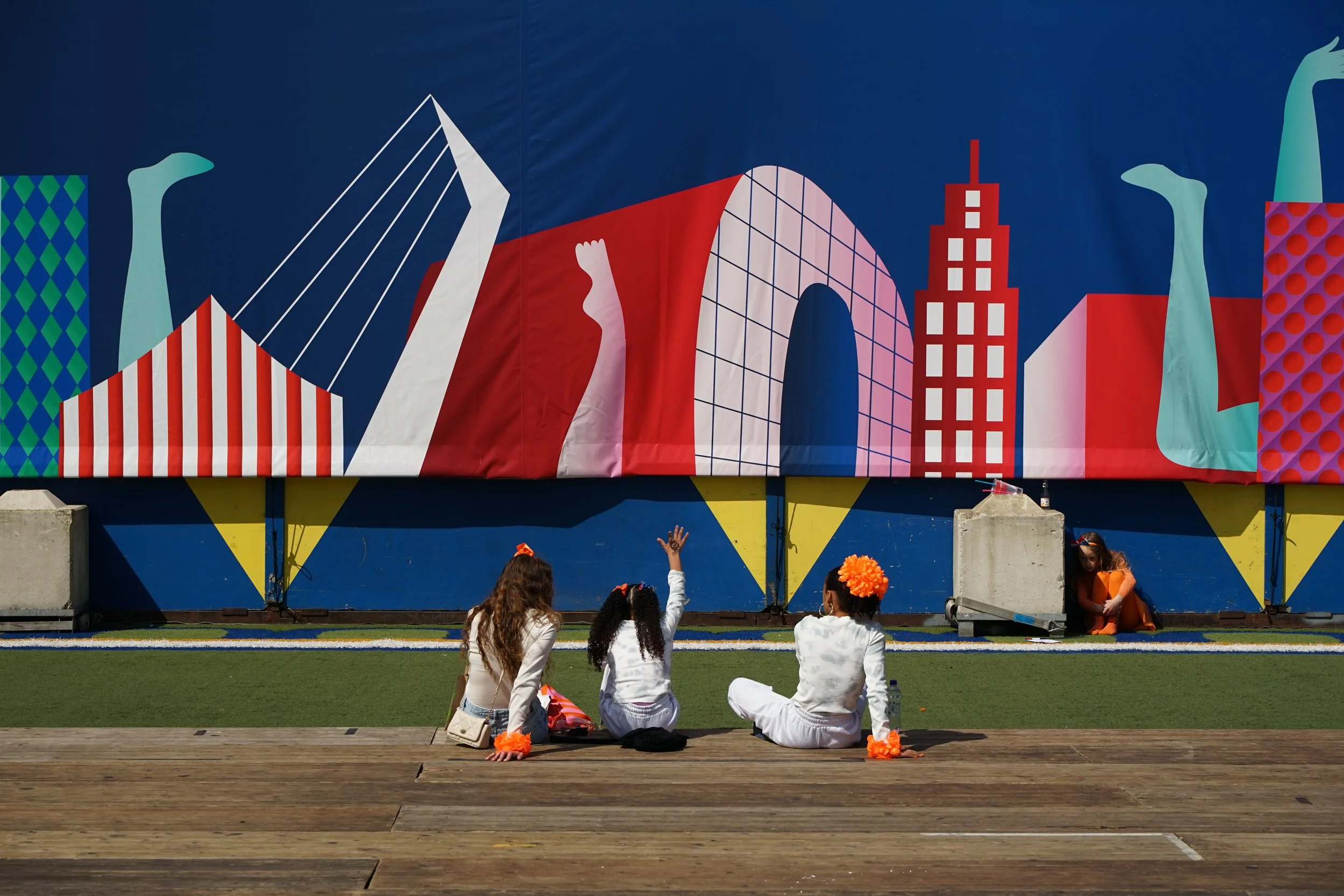 Children play with banner on King's Day