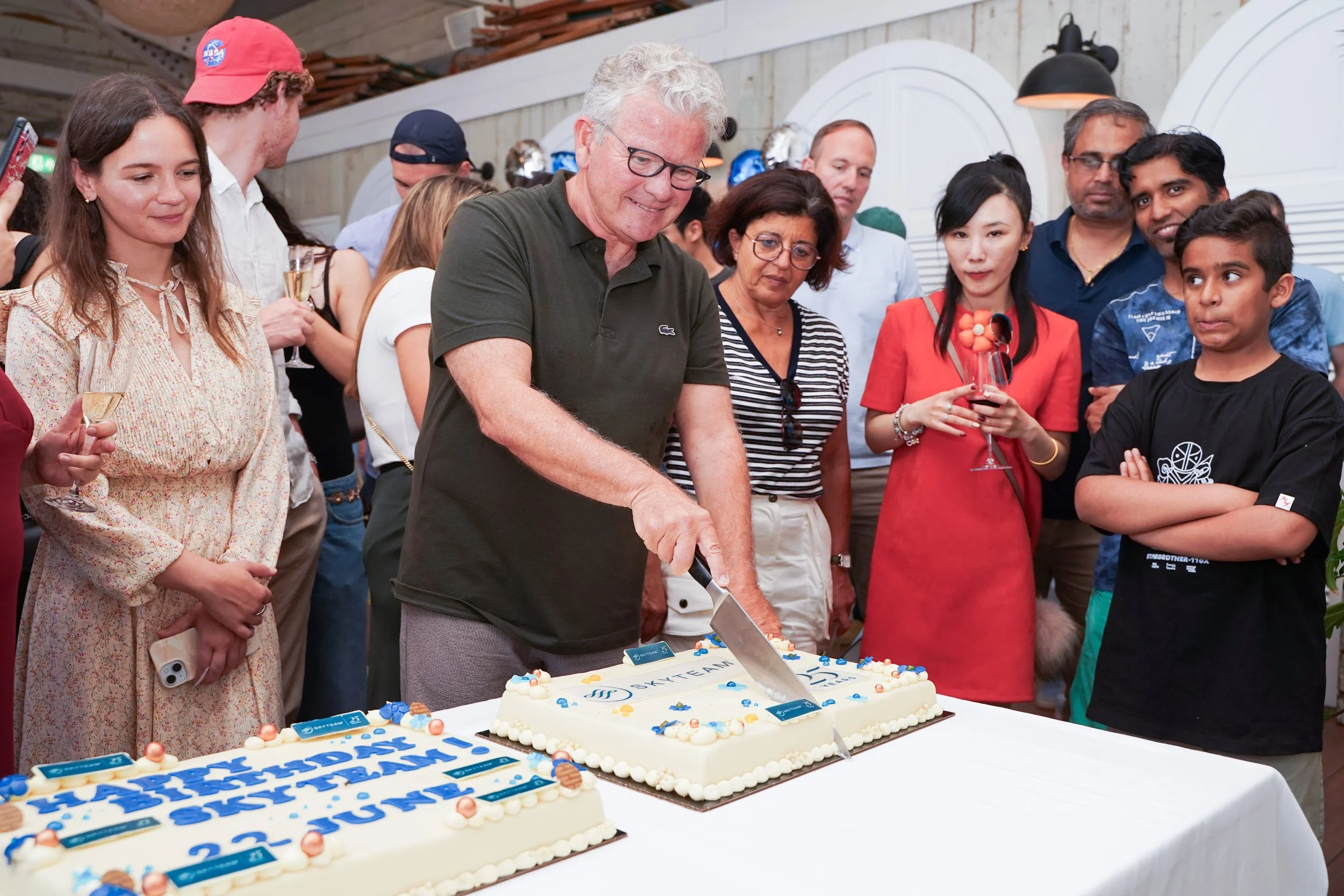 skyteam 25 anniversary cake cutting.jpg