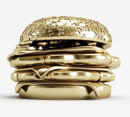 A burger made of shiny gold material, with a sesame seed bun, lettuce, and other burger ingredients.