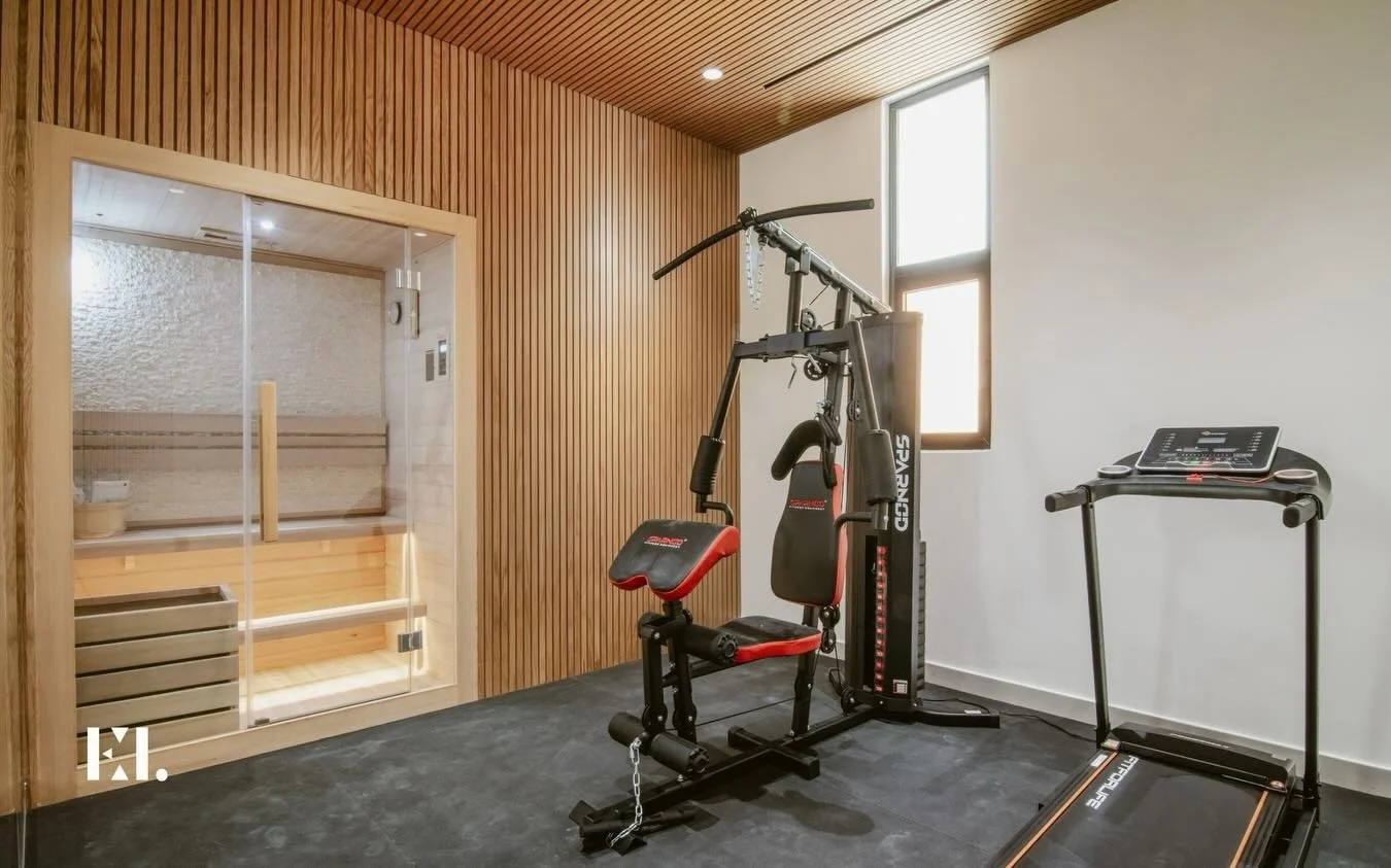 The hardest part of the workout?
Finding an excuse not to do it.

In this Brookfield renovation, we turned an underutilised area into a dual sauna and gym space, proving that wellness corners don&rsquo;t have to feel like afterthoughts.
With slatted 