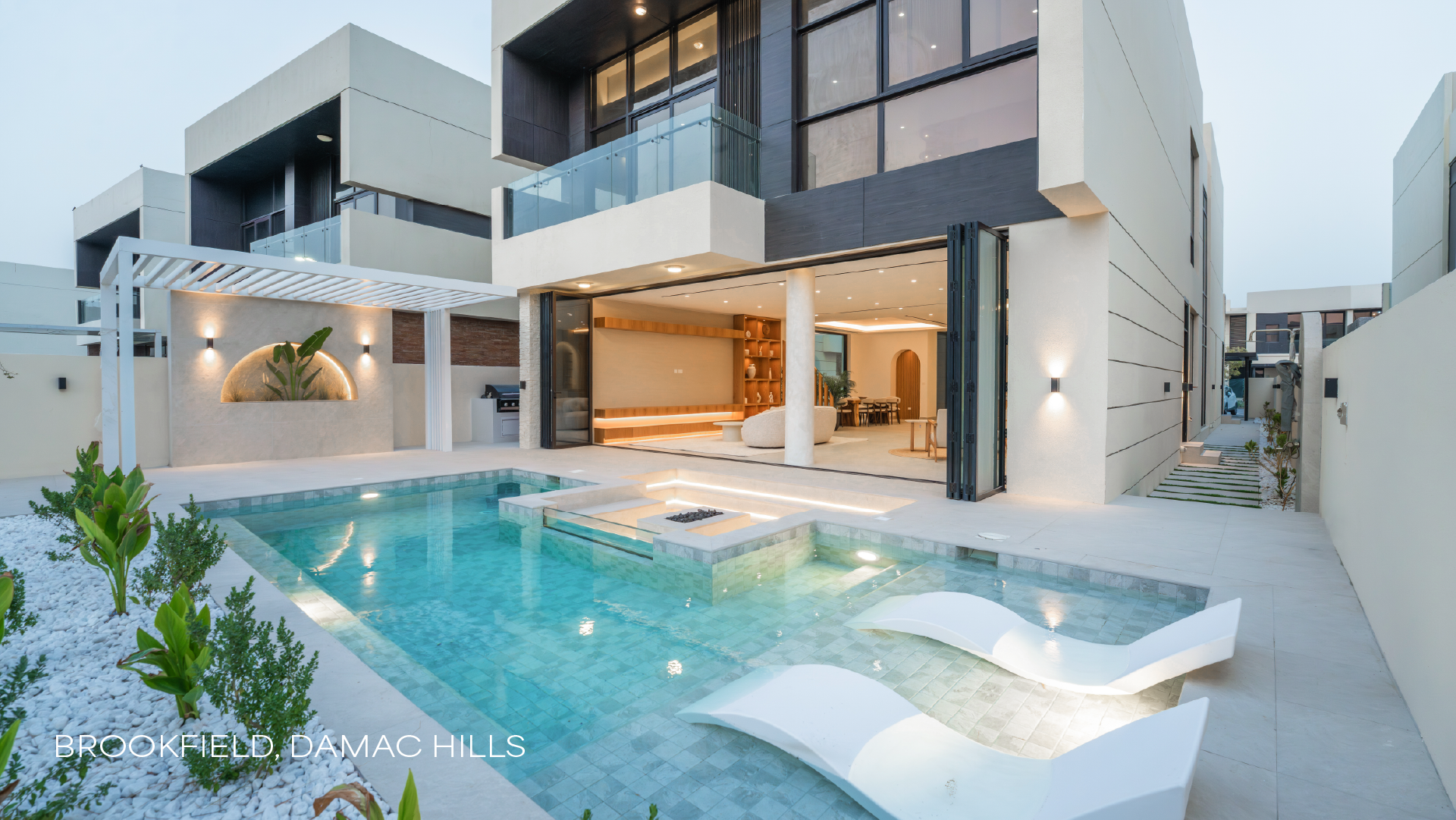 Renovated Brookfield, Damac Hills villa exterior with swimming pool, pergola and indoor-outdoor living area