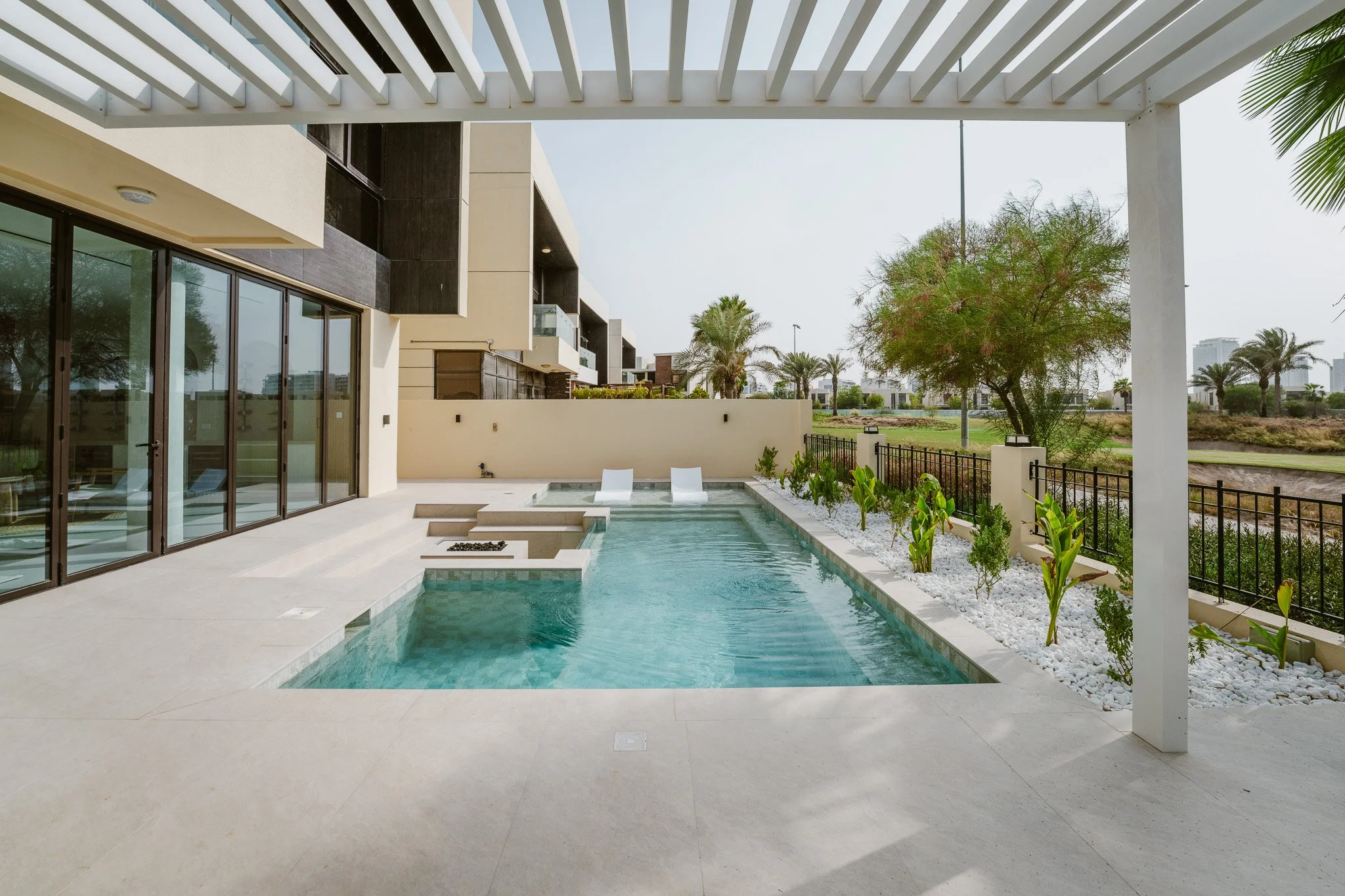 Dubai villa swimming pool and landscaped outdoor terrace after renovation