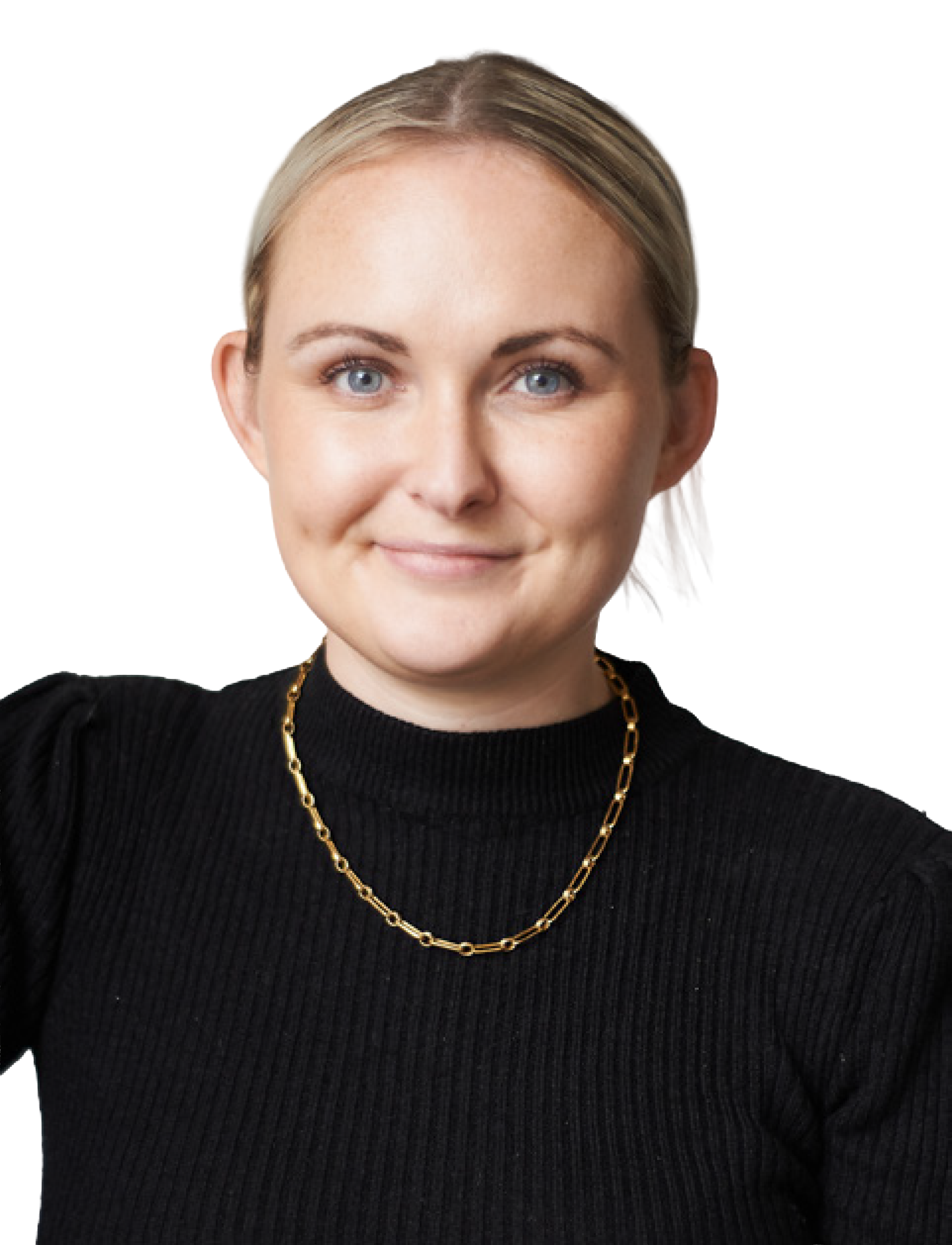A young woman with blonde hair styled in loose waves, wearing a black ribbed turtleneck sweater, a gold chain necklace, and smiling confidently at the camera.