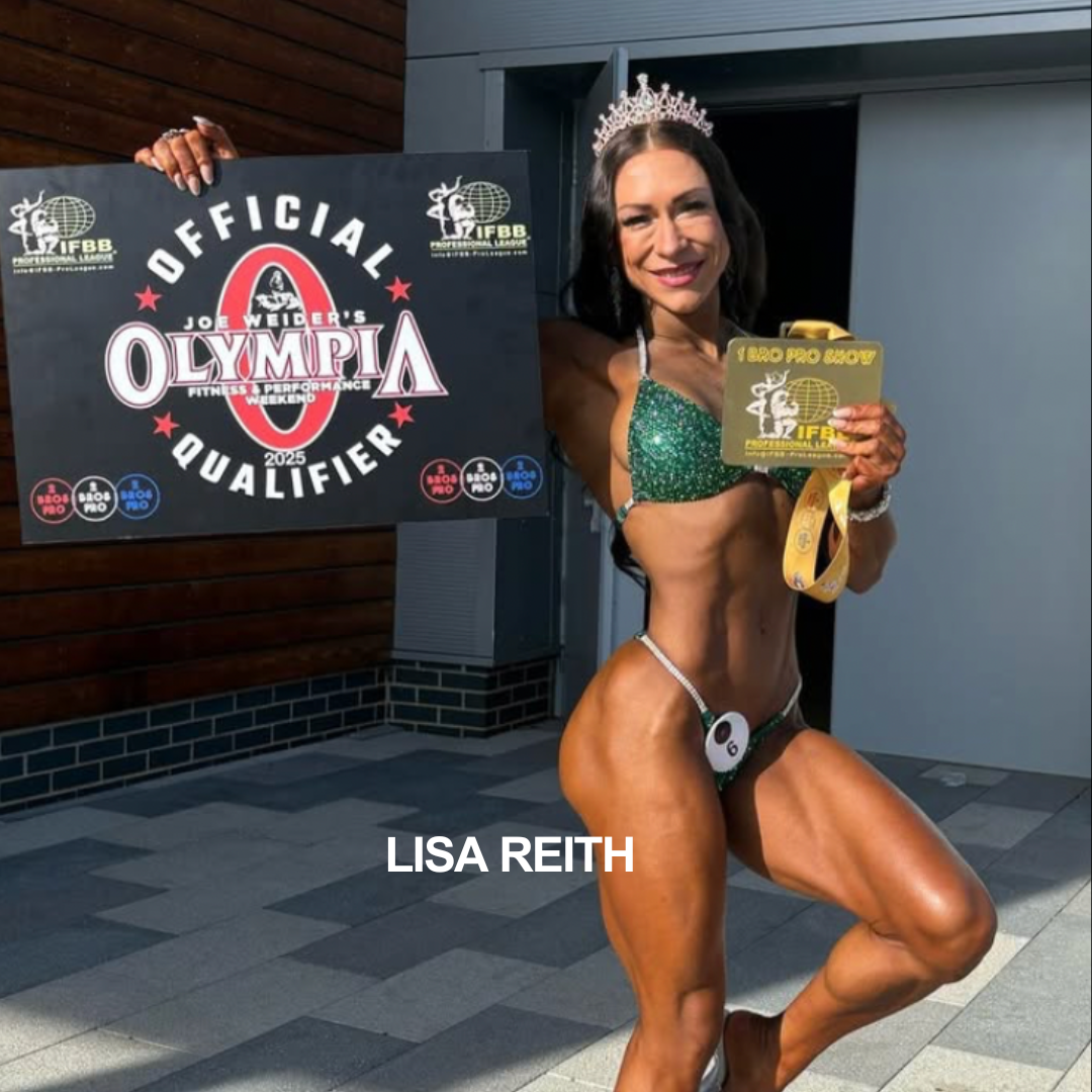 A woman in a bikini with a bikini number, wearing a tiara, holding a medal and standing next to an 'Olympia Qualification' sign, smiling at a fitness competition.