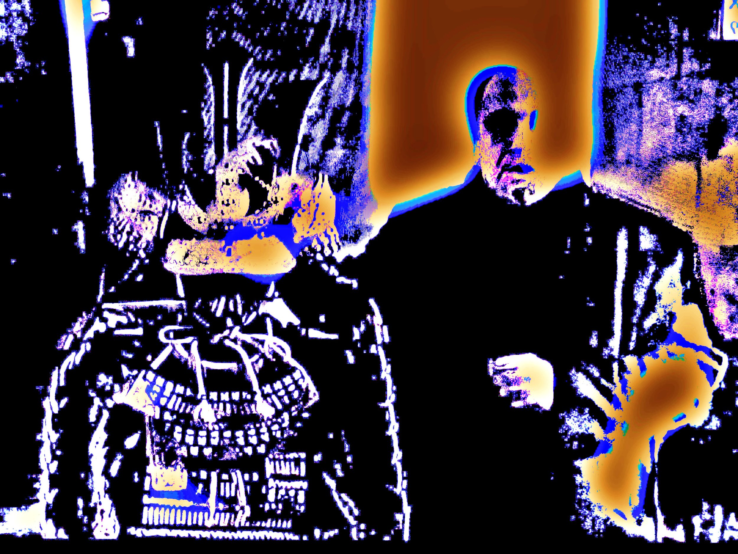 A stylized, high-contrast, color-inverted image of a man and a woman standing indoors. The woman is on the left, holding a cell phone, and the man is on the right, with his hand raised. Both figures have altered, psychedelic color outlines.