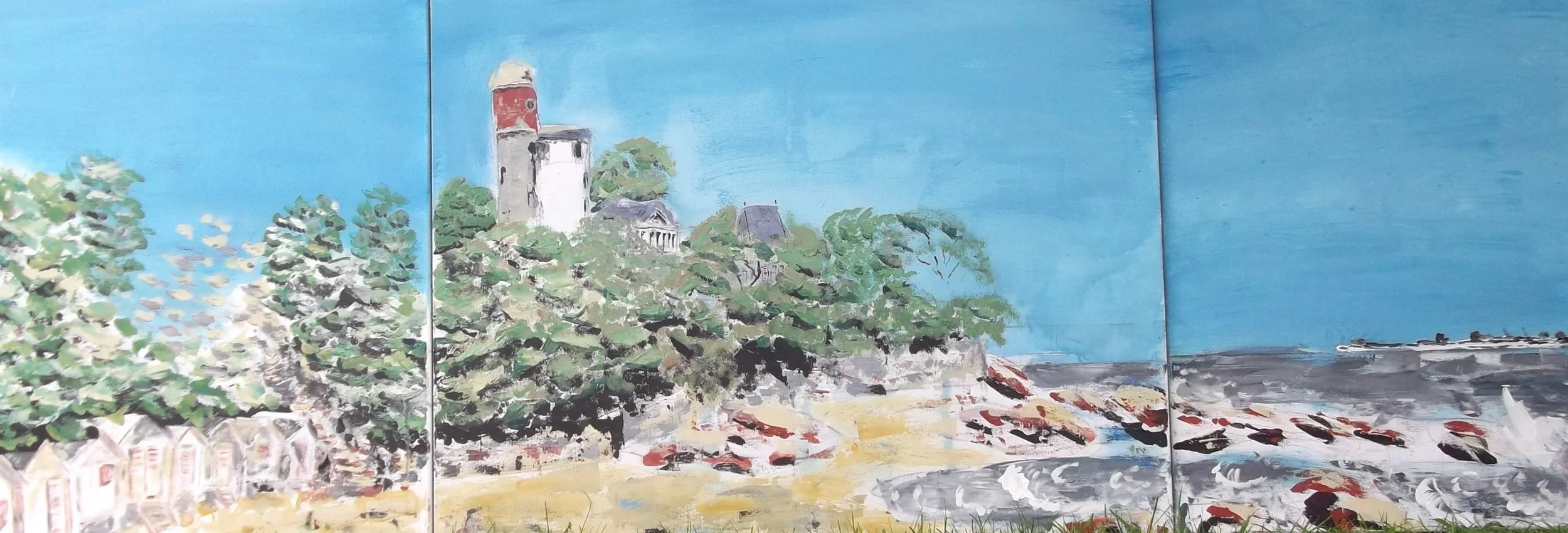 Painted mural of a seaside landscape with a castle, trees, rocks, and boats in the water under a clear blue sky.