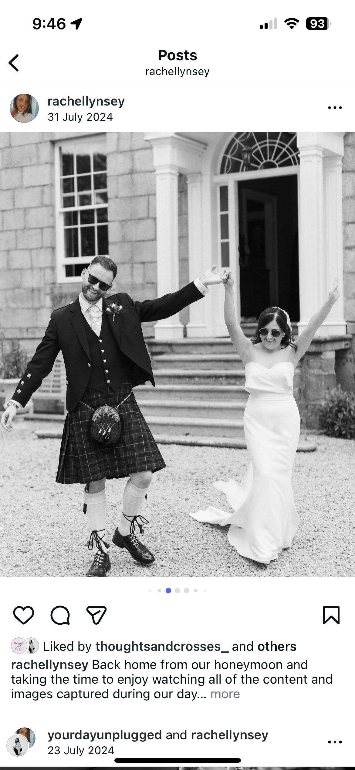 A black and white photo of a newly married couple celebrating outside a stone building, with the man wearing a kilt, blazer, and sunglasses, and the woman in a strapless wedding dress and sunglasses, both with arms raised.