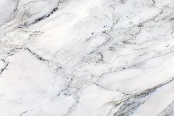 Close-up of white and gray marble surface with natural veining.