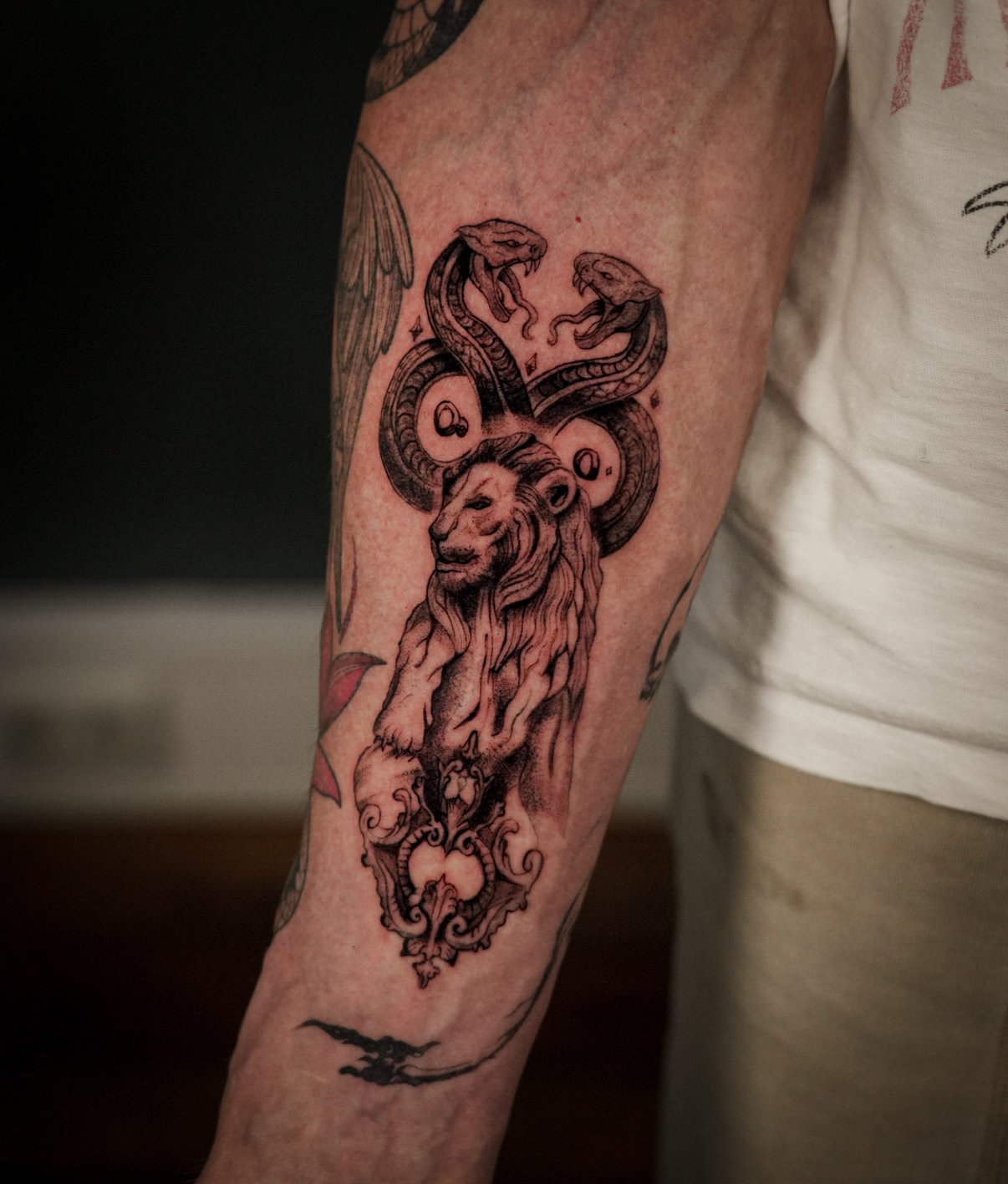 Underarm microrealism tattoo composition by Thomas Tranchina