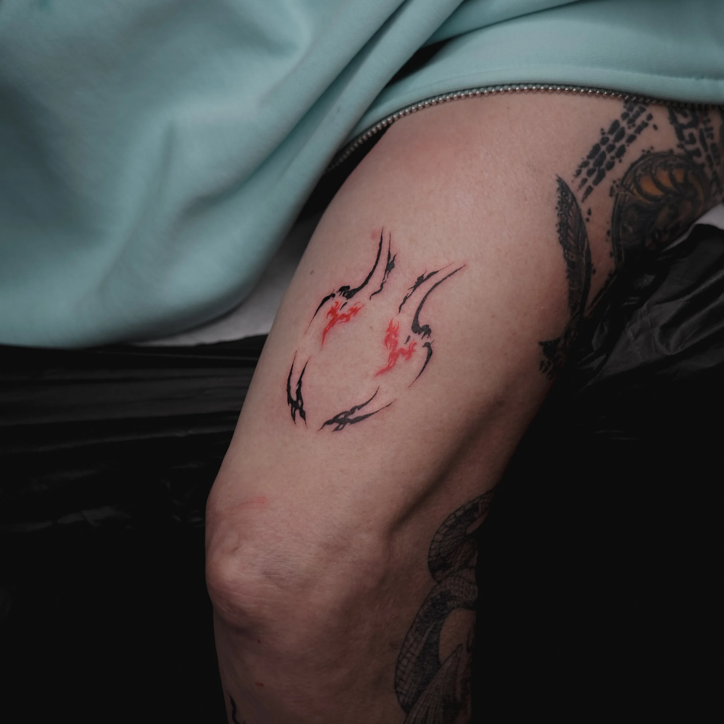 ornamental symbolism tattoo black and red