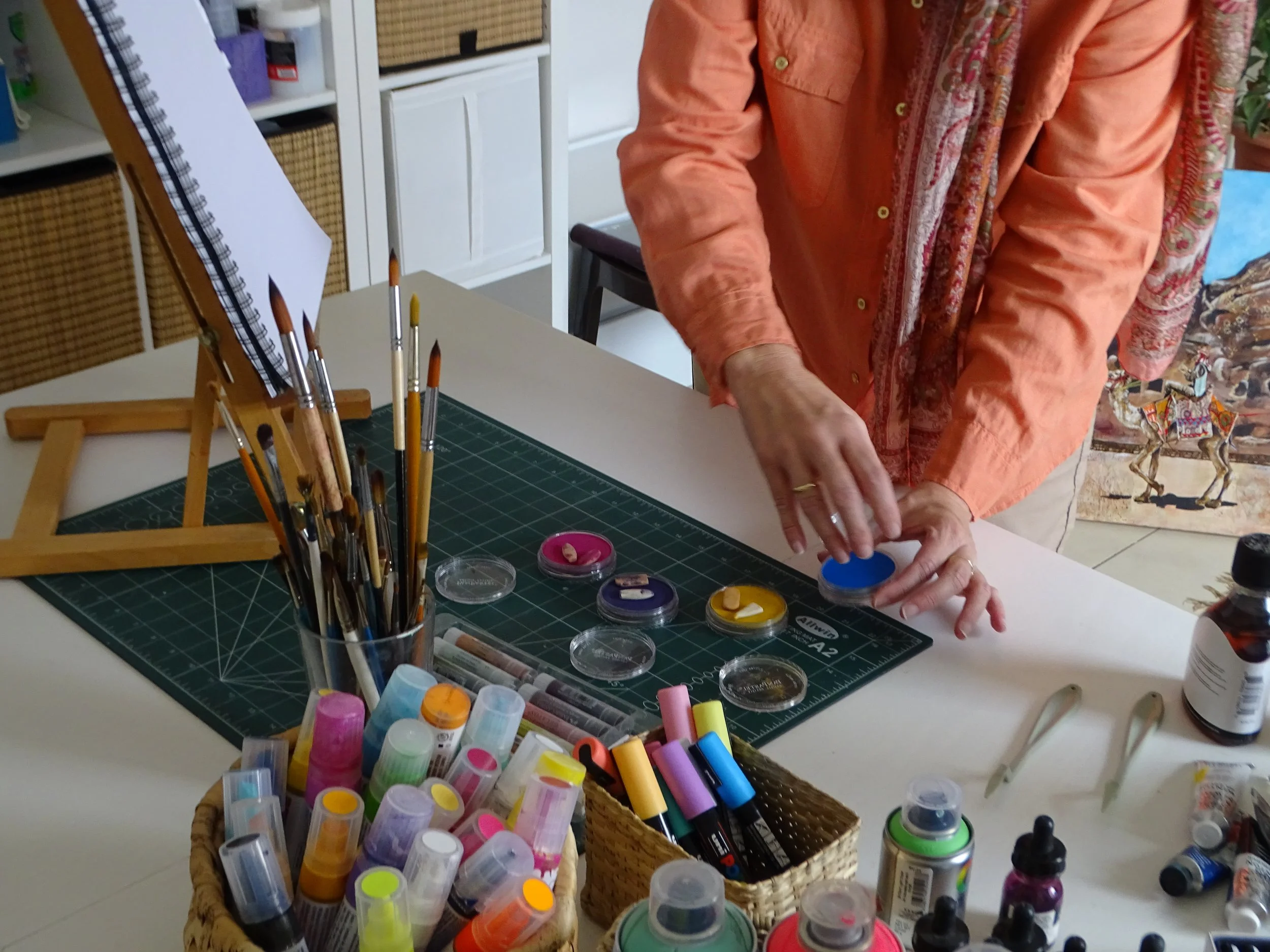Liezle Wilken in her studio, working with a variety of mixed media to create layered oil and ink paintings.  An inside look at her creative and prayerful process.