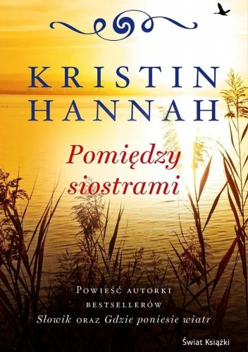 Book cover with yellow and orange tones, silhouette of reeds and trees near water, and a bird flying in the sky. The title is 'Pomiedzy siostrami' by Kristi Hannah.