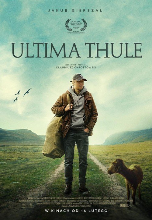 Movie poster for "Ultima Thule" showing a young man with a backpack standing on a path in a vast, green landscape with mountains and a cloudy sky, and a small dog nearby. Birds are flying in the distance.