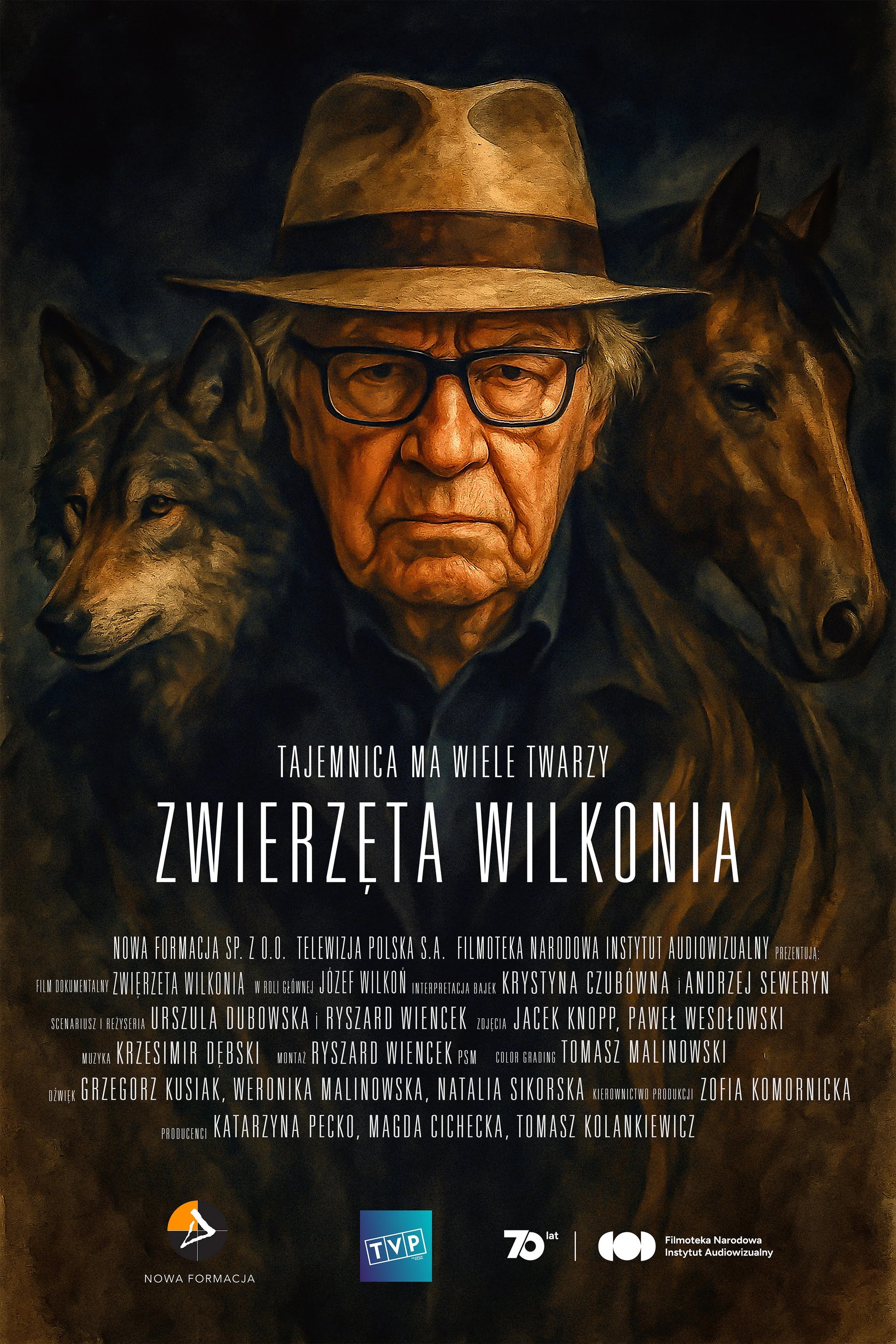 Poster for a documentary film titled 'Zwierzęta Wilkonia'. The poster features an elderly man wearing glasses and a hat, surrounded by animals including a wolf and a horse. The text includes details in Polish about the film's production team and broadcasting agencies.
