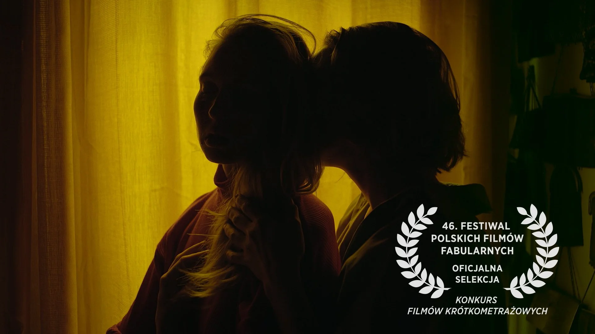 Silhouettes of two women touching foreheads against a yellow curtain, with text indicating participation in an official short film contest at the 46th Polish Film Festival, Fabulary.