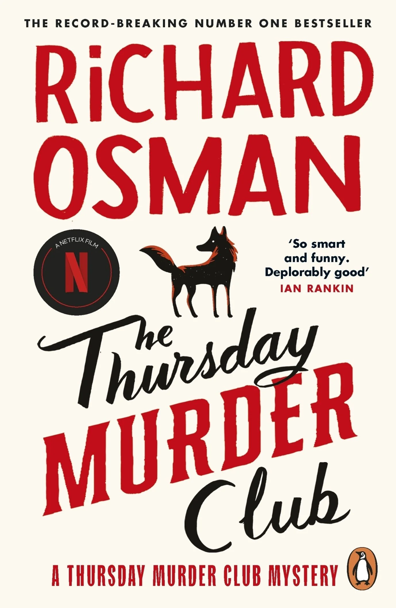 Book cover for "The Thursday Murder Club" by Richard Osman, featuring large red and black text, a black dog illustration, a Netflix film badge, and the Penguin logo at the bottom right.