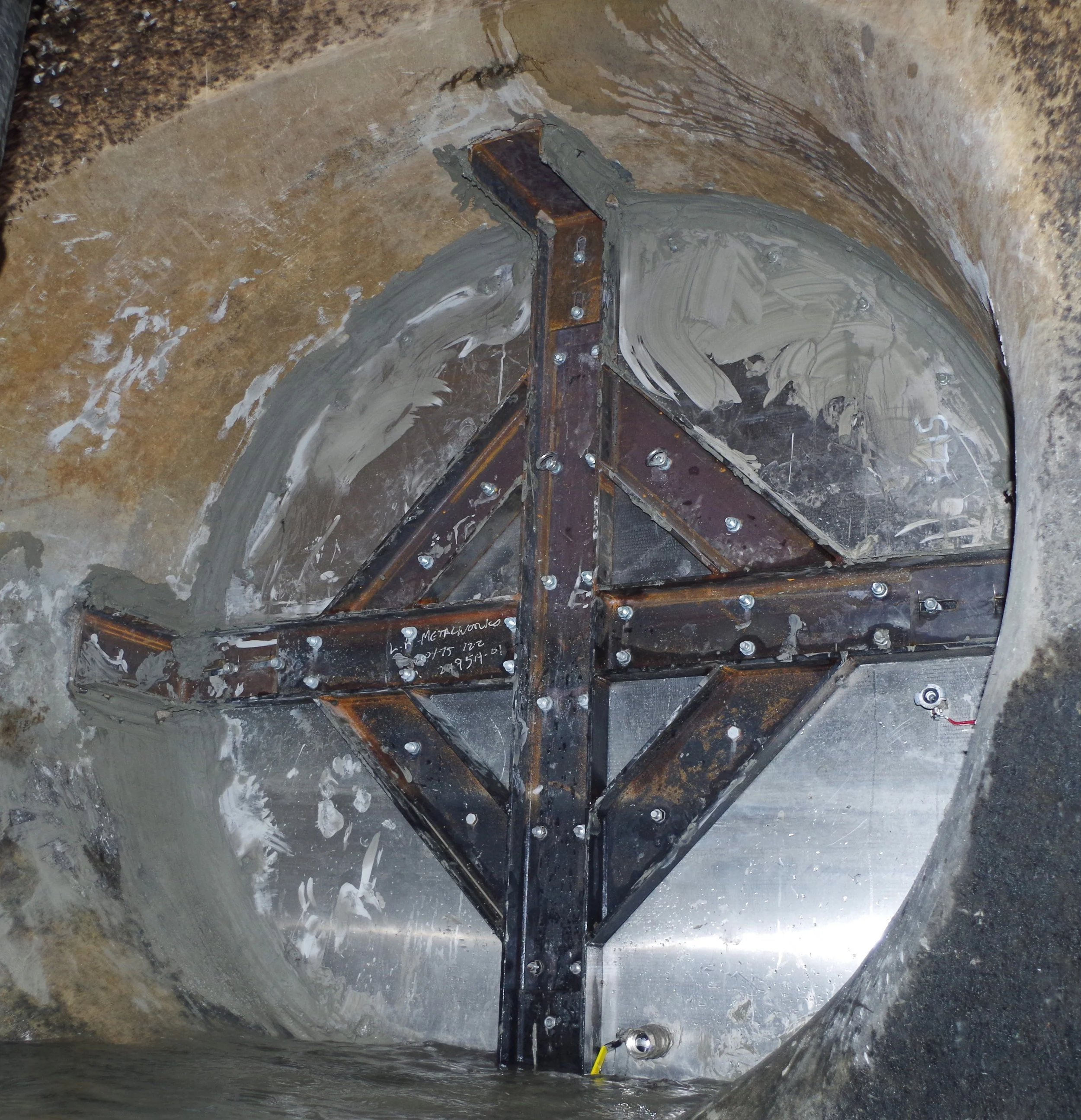 Installed bespoke secondary isolation plate 