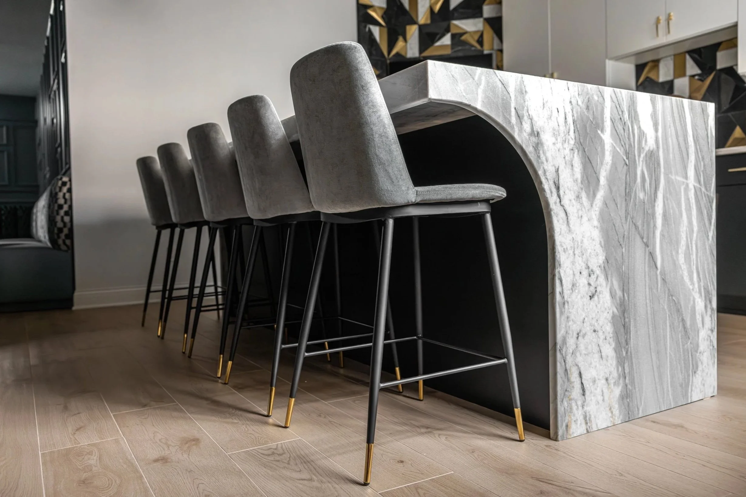 03-luxury-basement-bar-marble-waterfall-island.jpg