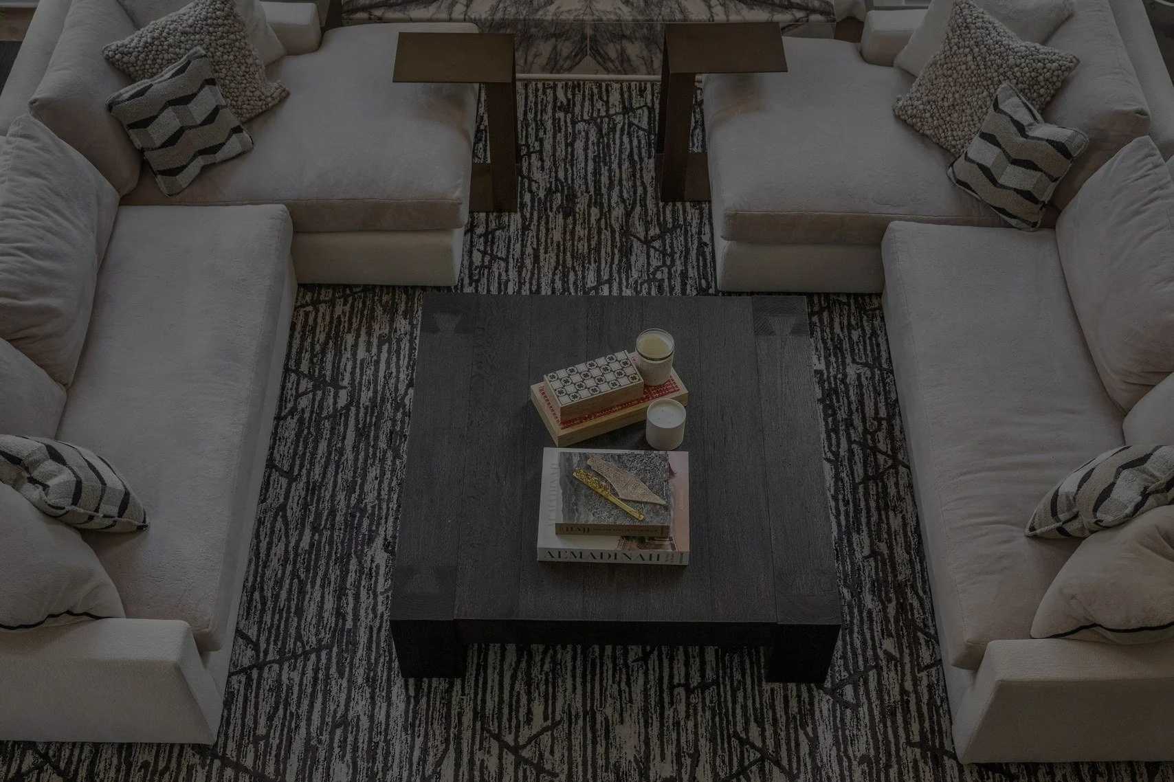 Overhead view of a living room with two sofas and two lounge chairs arranged for conversation