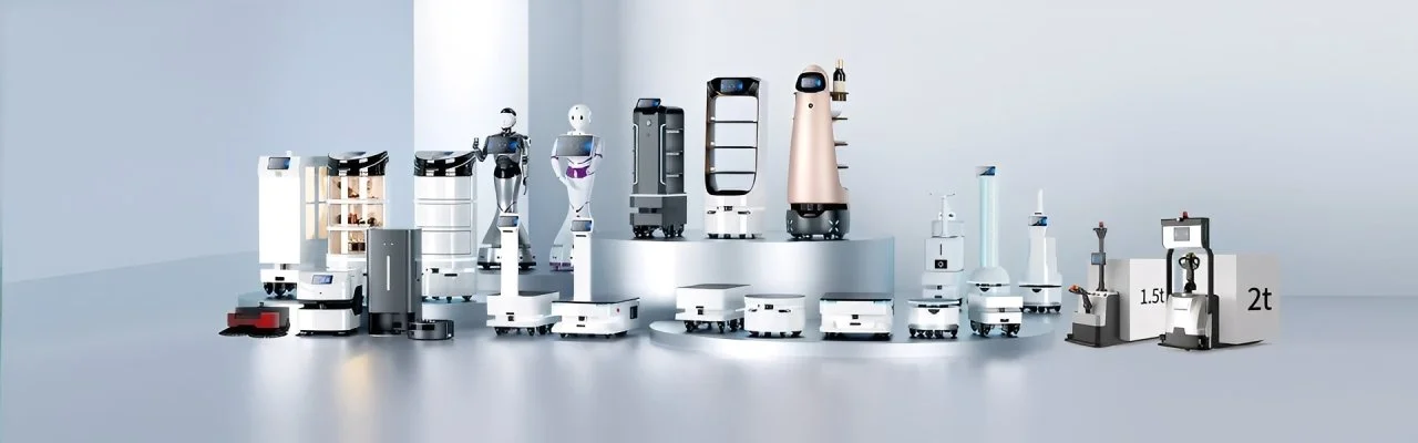 Collection of various robots and robotic equipment displayed on a platform against a plain background.
